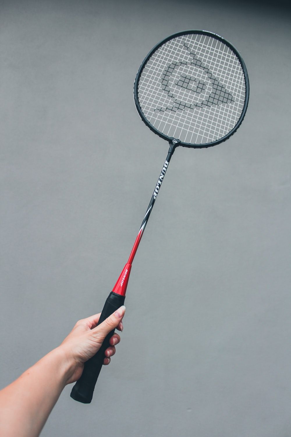 black and red Yonex badminton racket photo