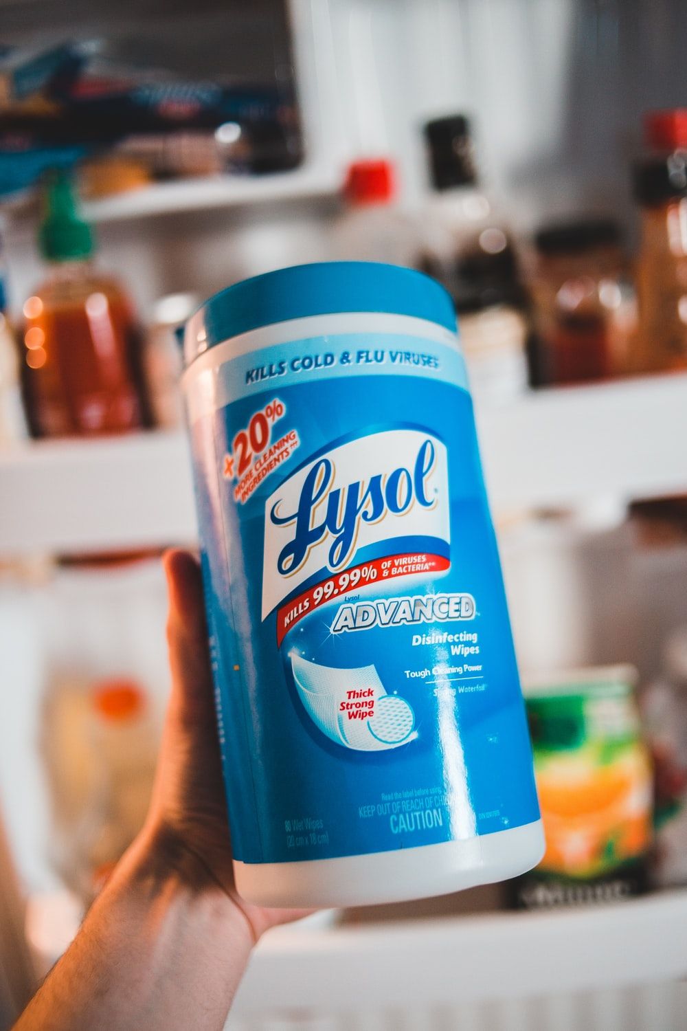 person holding blue and white clorox disinfecting wipes photo