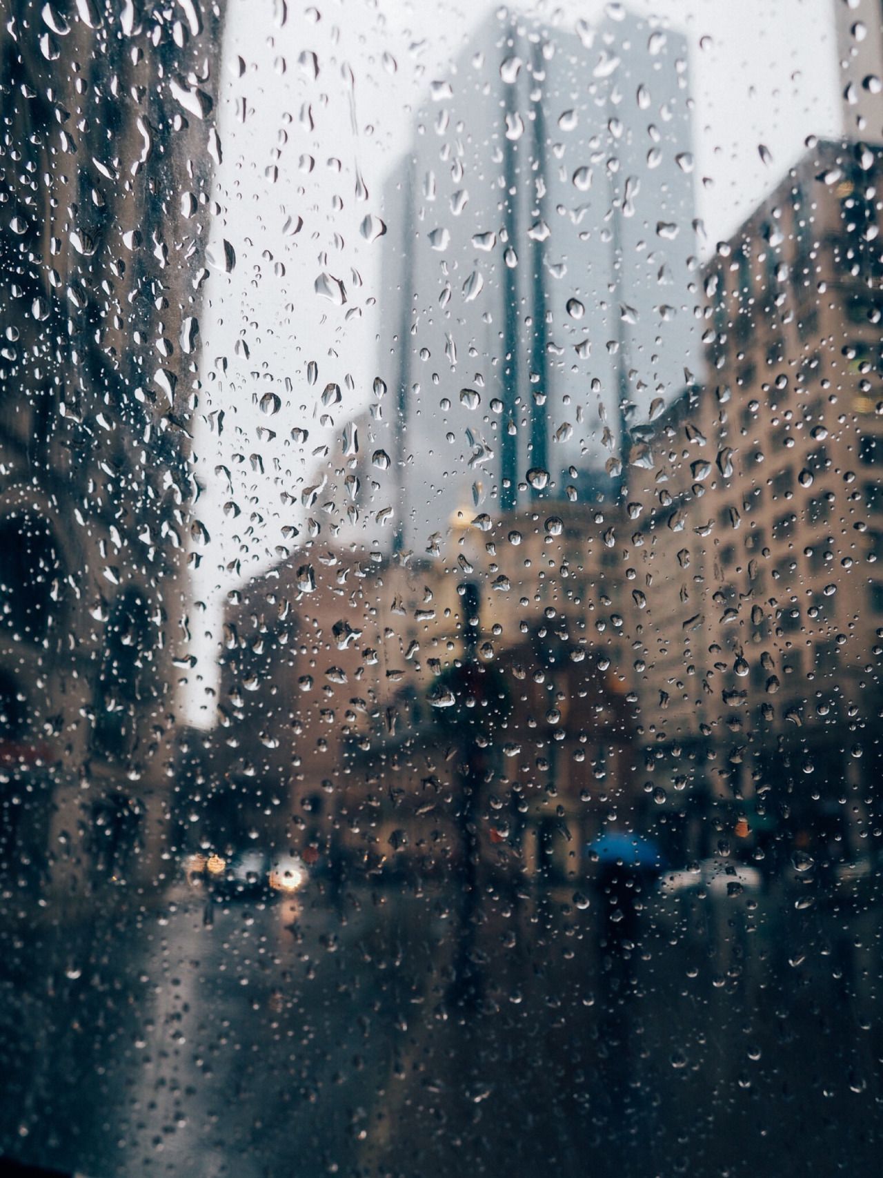 It's raining in the city. Rainy day wallpaper, Rainy days, Rain photography