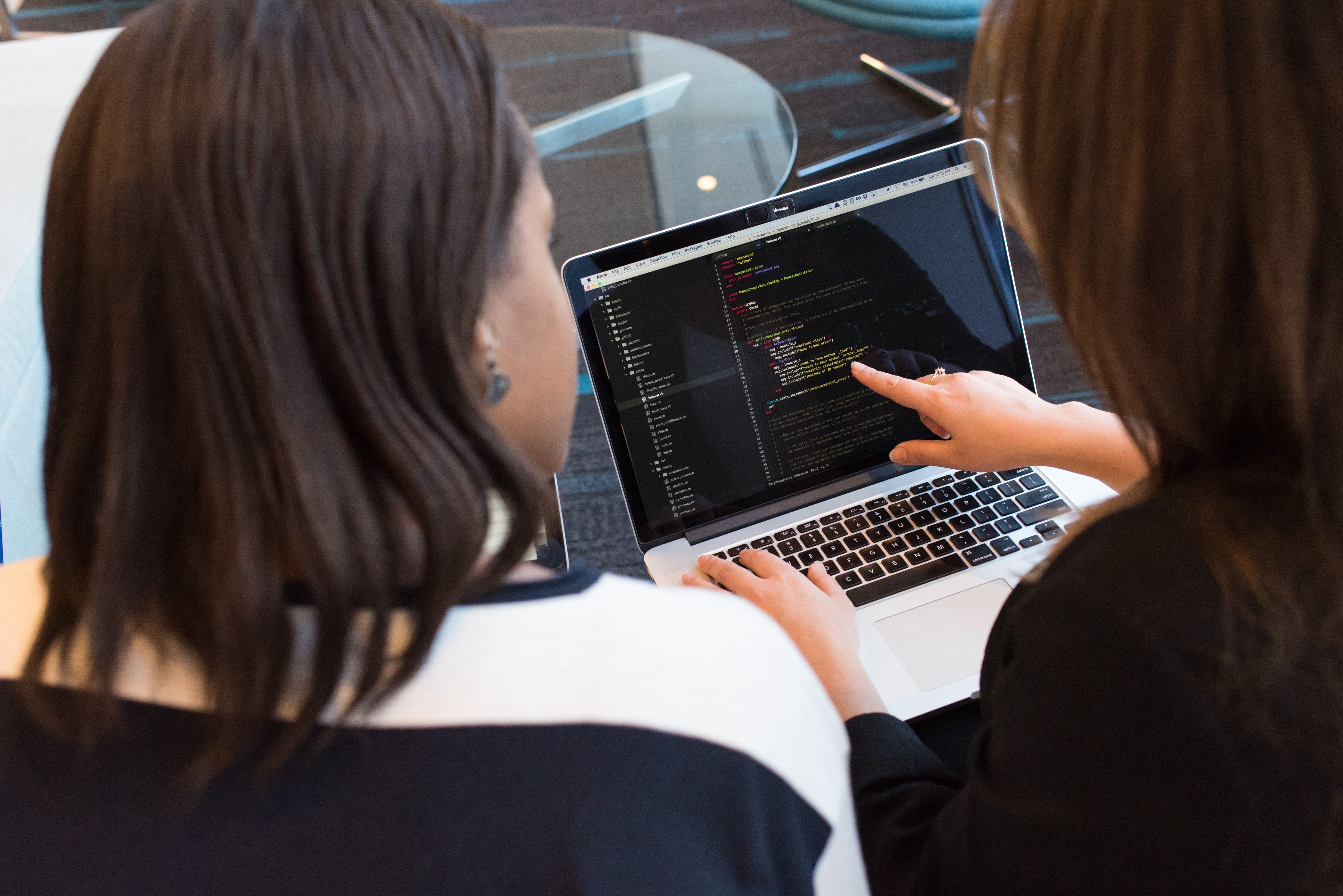 Two Women Looking at the Presentation at Laptop wallpaper