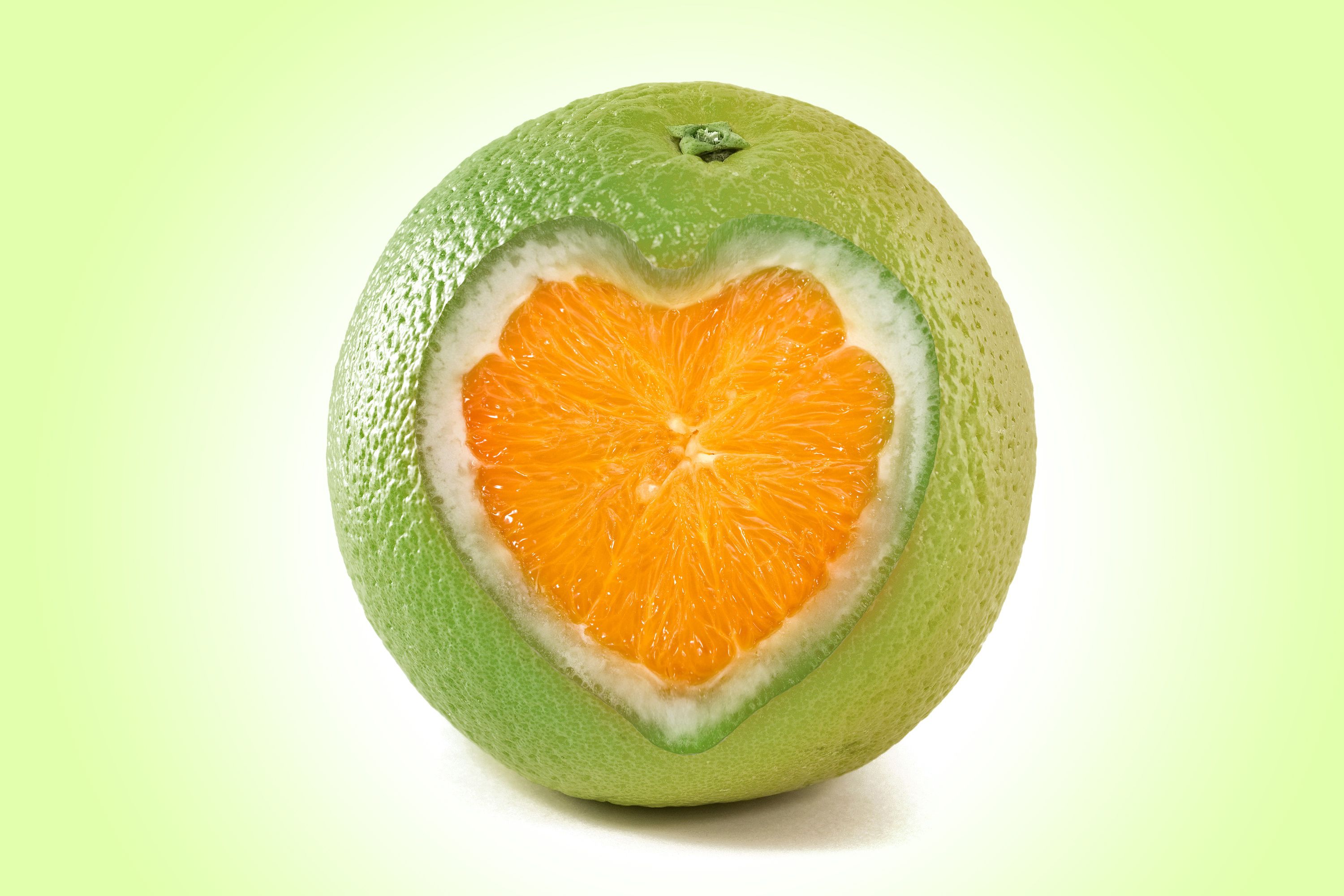 Download Wallpaper fruit heart orange, 3000x Orange with slice in the form of heart