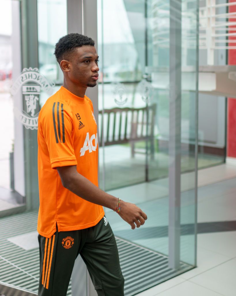 Amad Diallo pictured posing with the Manchester United shirt as he is finally unveiled In Focus