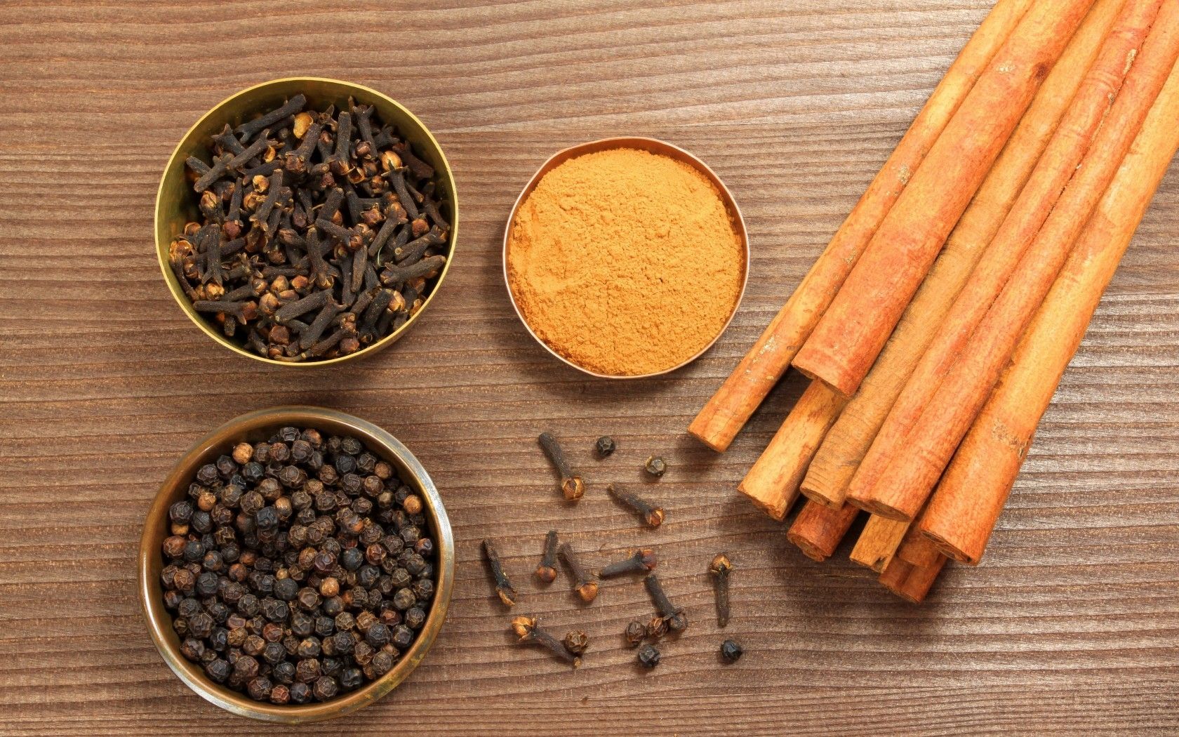 Wallpaper, spices, table, bowls, cinnamon, cloves, black pepper, curry 1680x1050