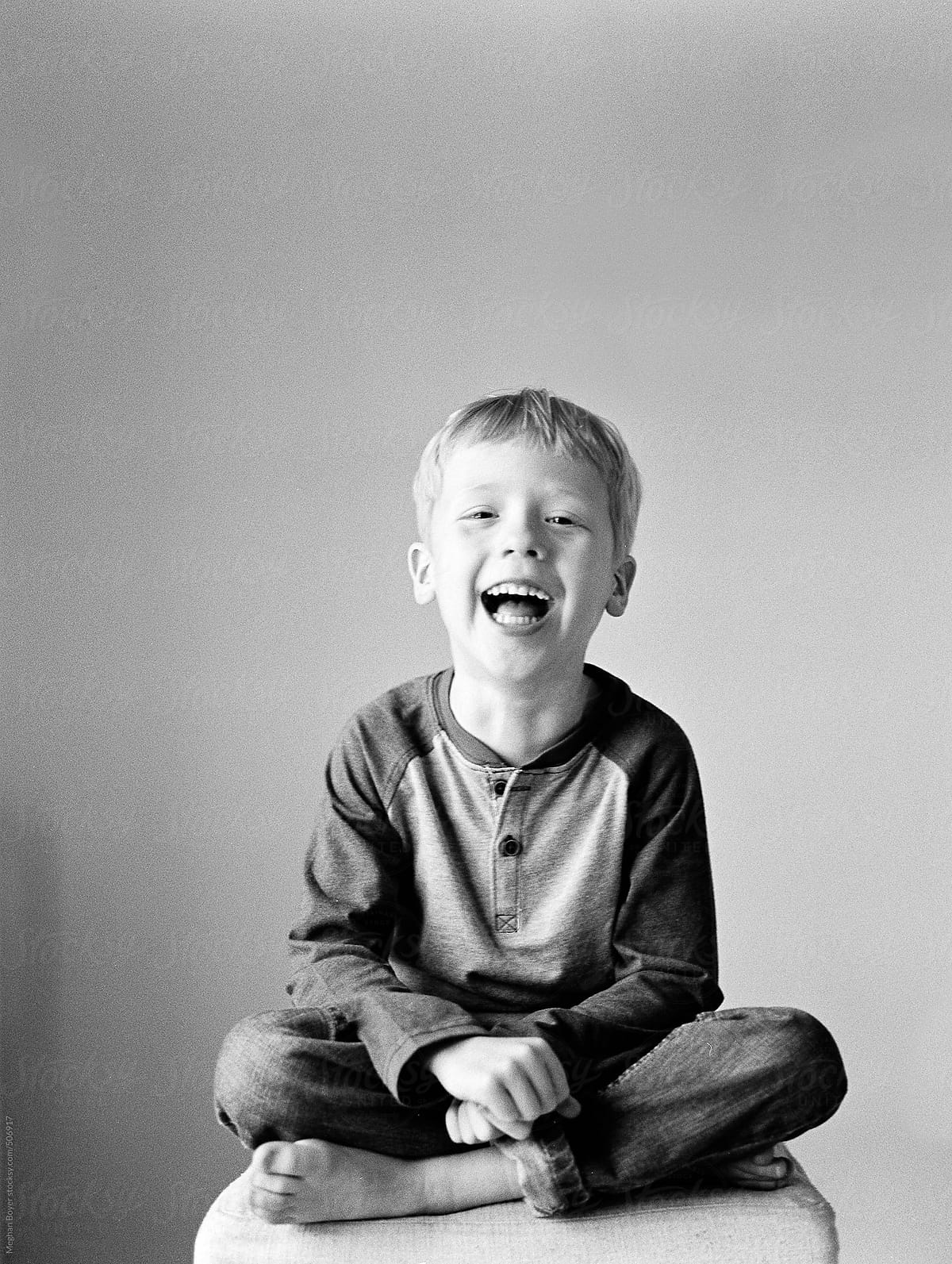 Cute Laughing Boy In Black And White