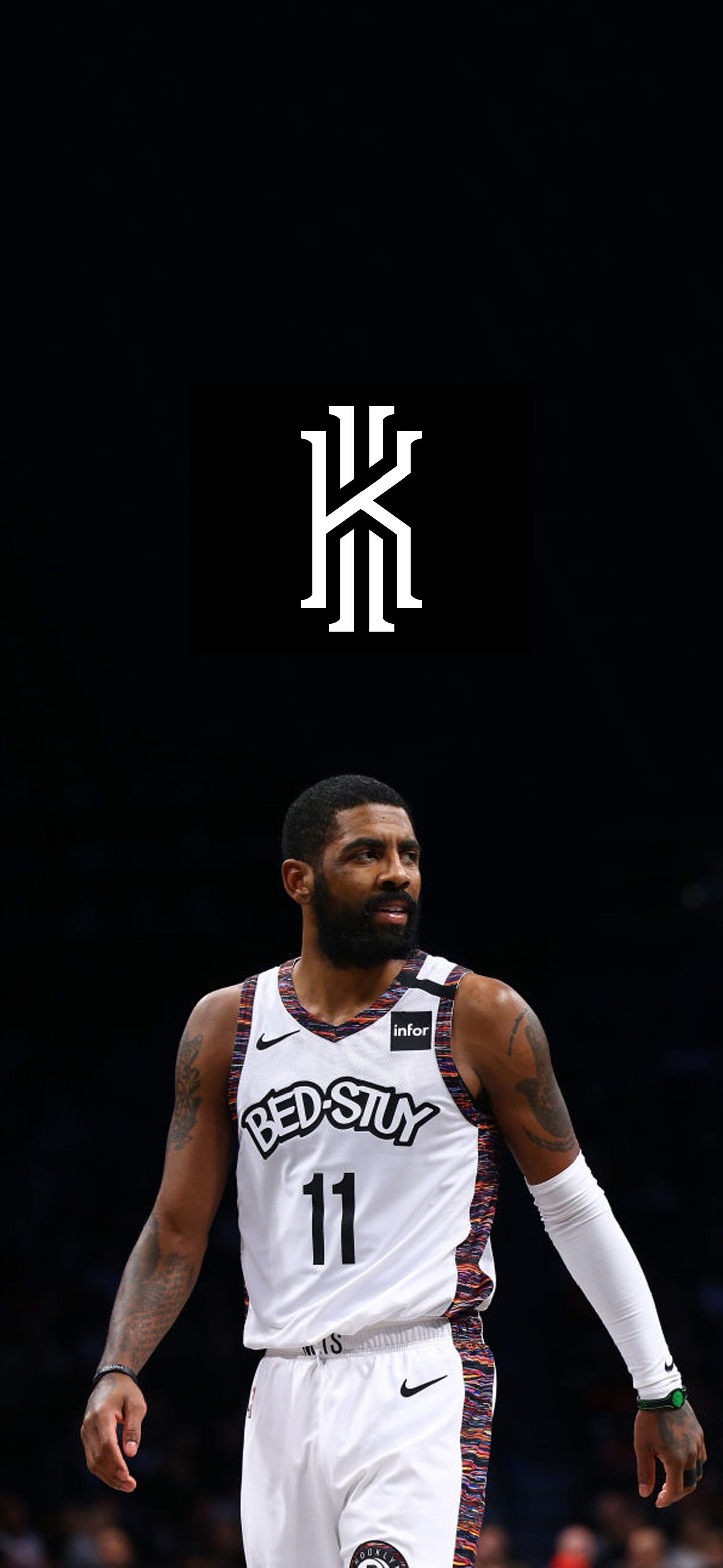 Download Kyrie Irving proudly displays his Brooklyn Nets jersey at his  introductory press conference Wallpaper