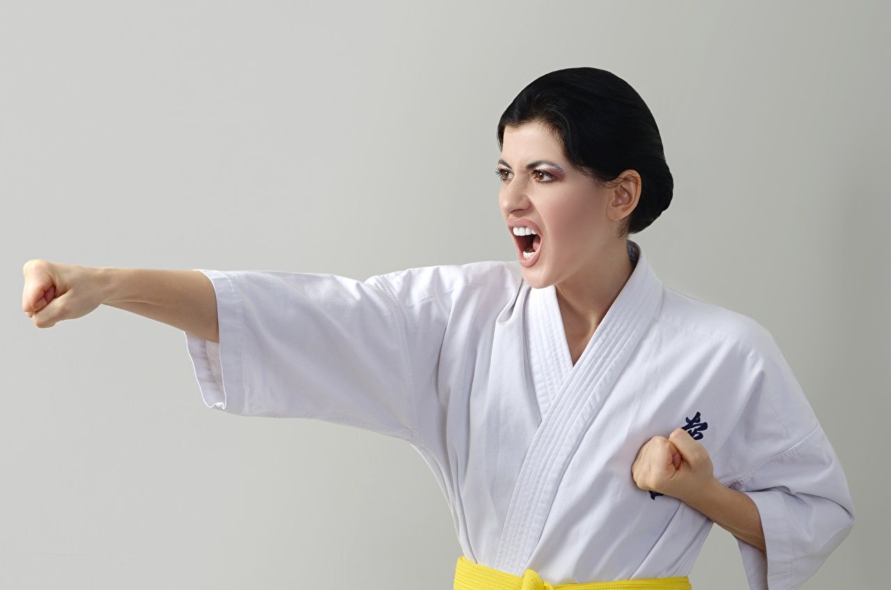 Desktop Wallpaper Girls Hands Brunette girl Uniform Karate To hit