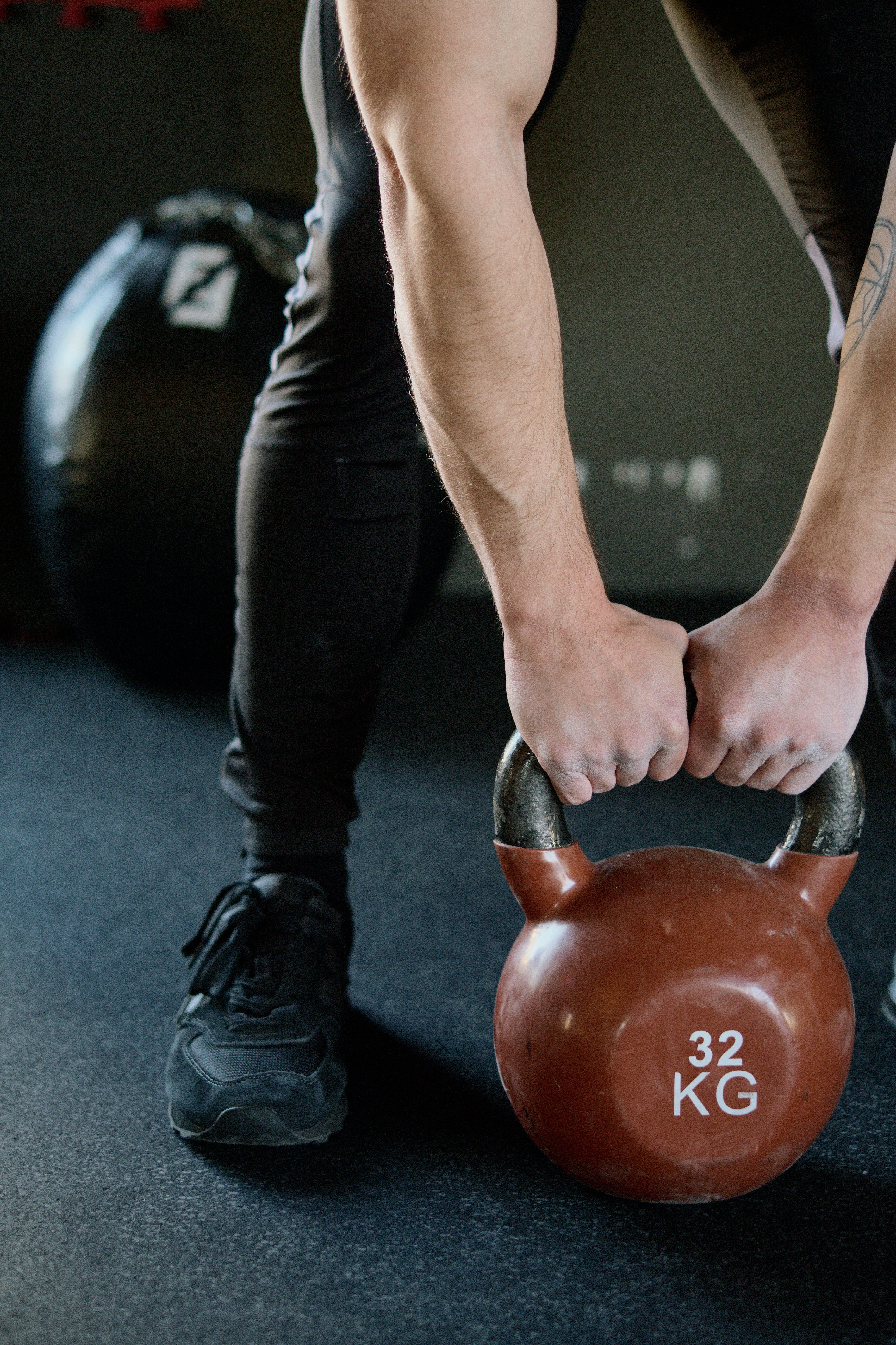 Person Holding Red Kettlebell · Free