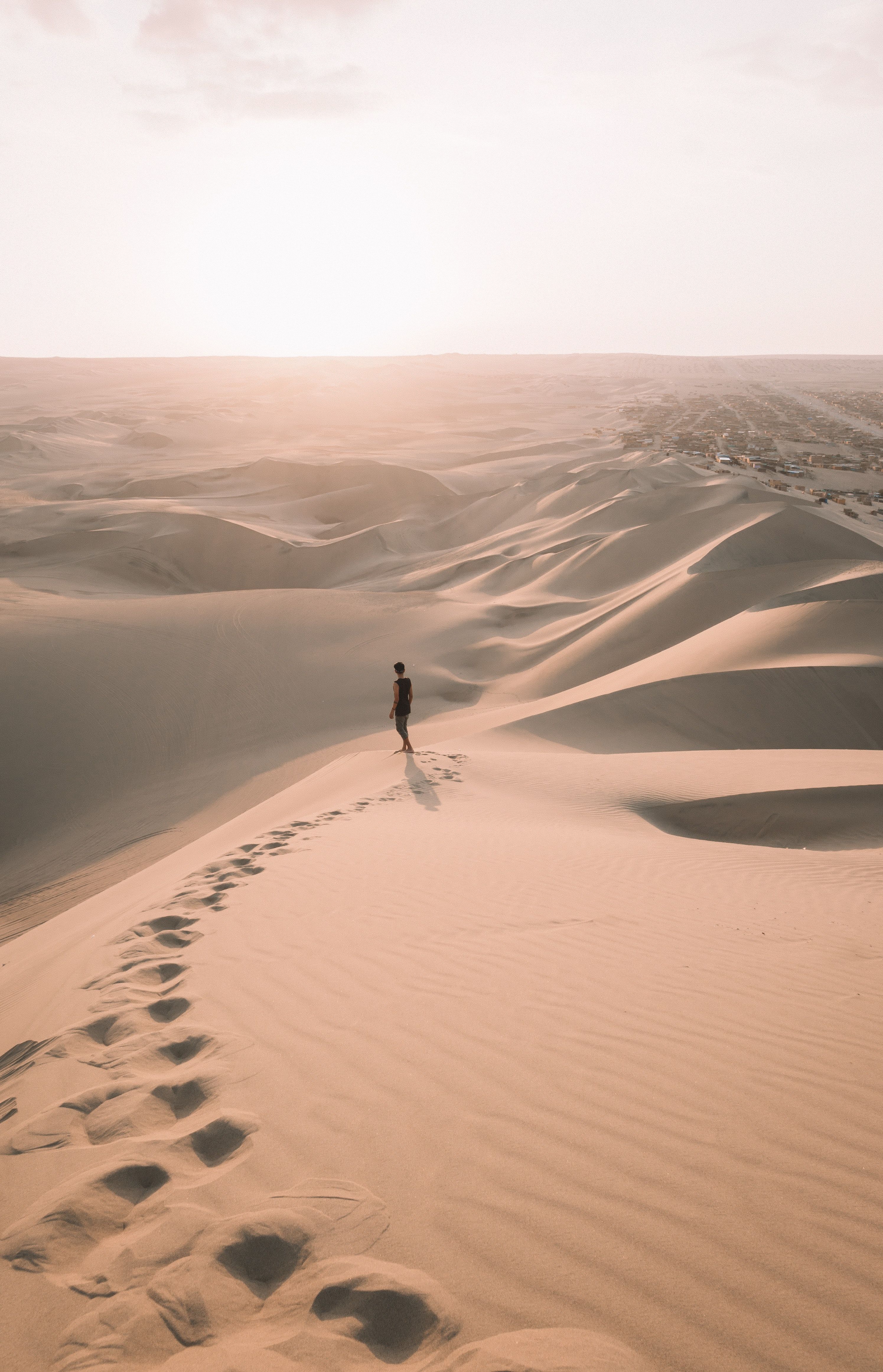 High Angle Shot Of A Person Walking Alone In The Desert · Free