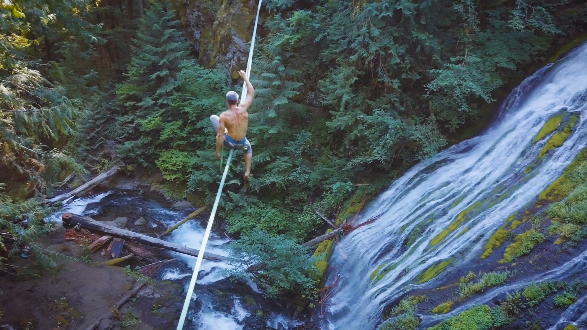 Fit Man Highlining Over A Waterfall Stock Video Footage