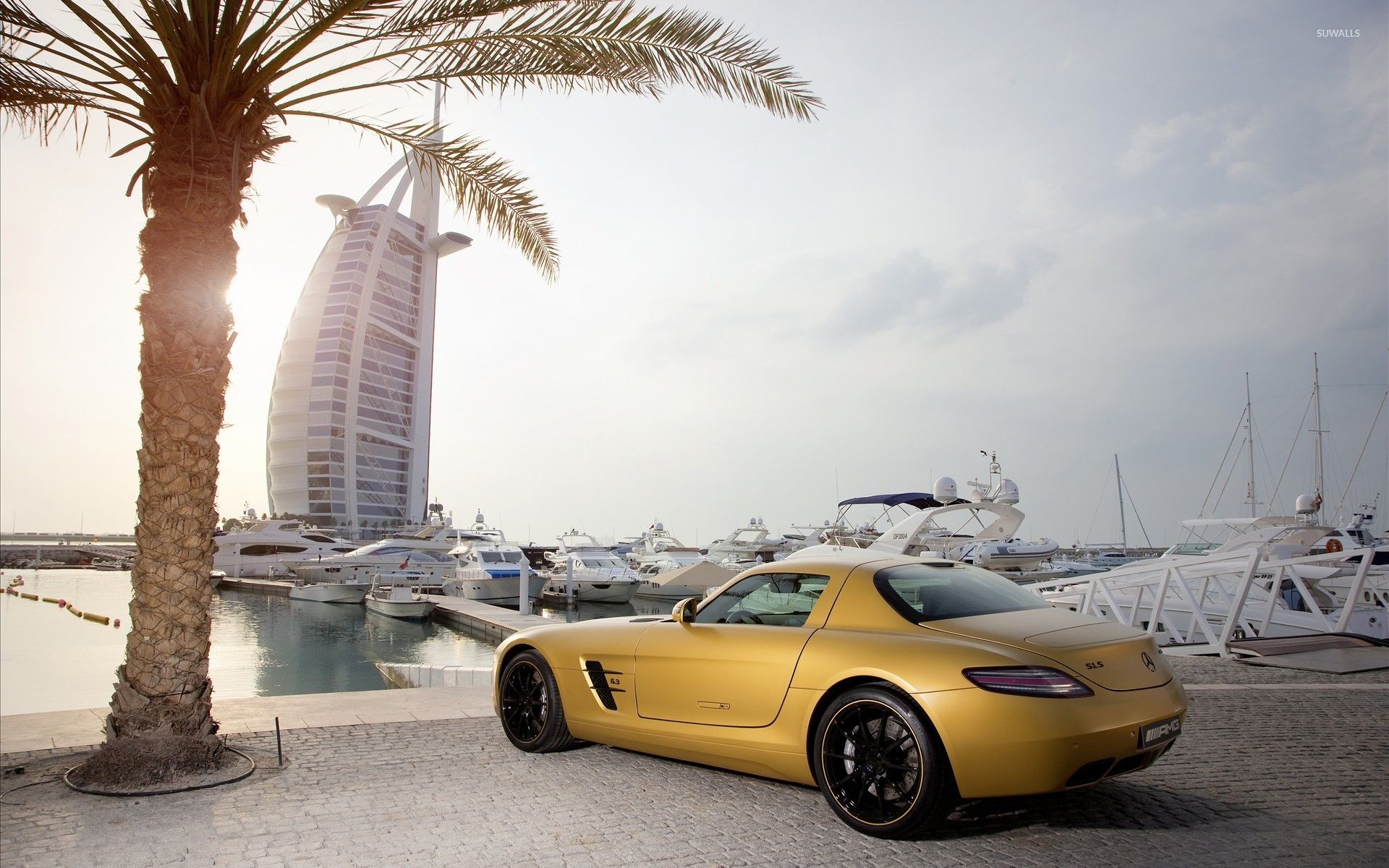 Yellow Mercedes Benz SLS AMG In Dubai Wallpaper Wallpaper