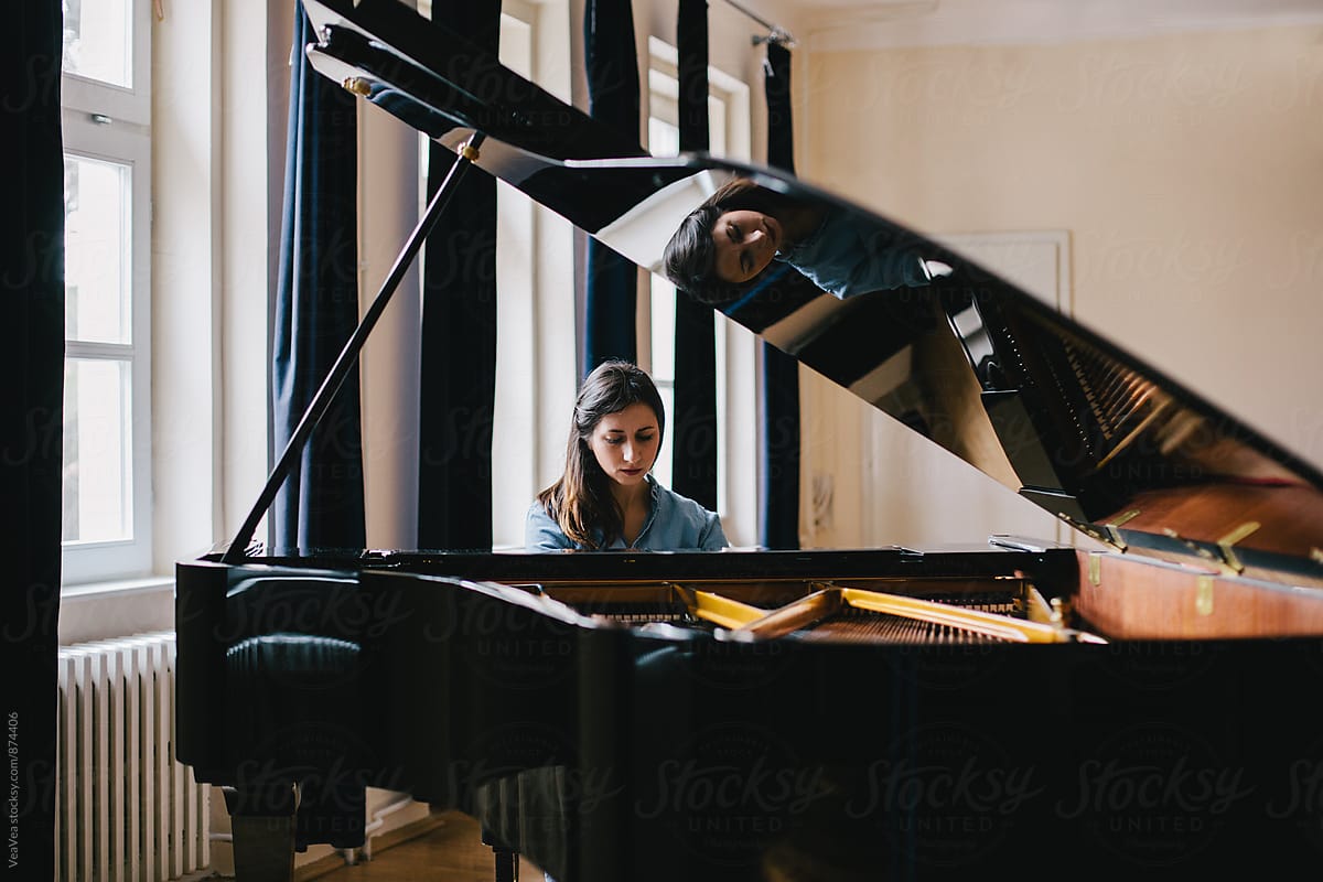 Brunette Woman Playing Piano Indoor