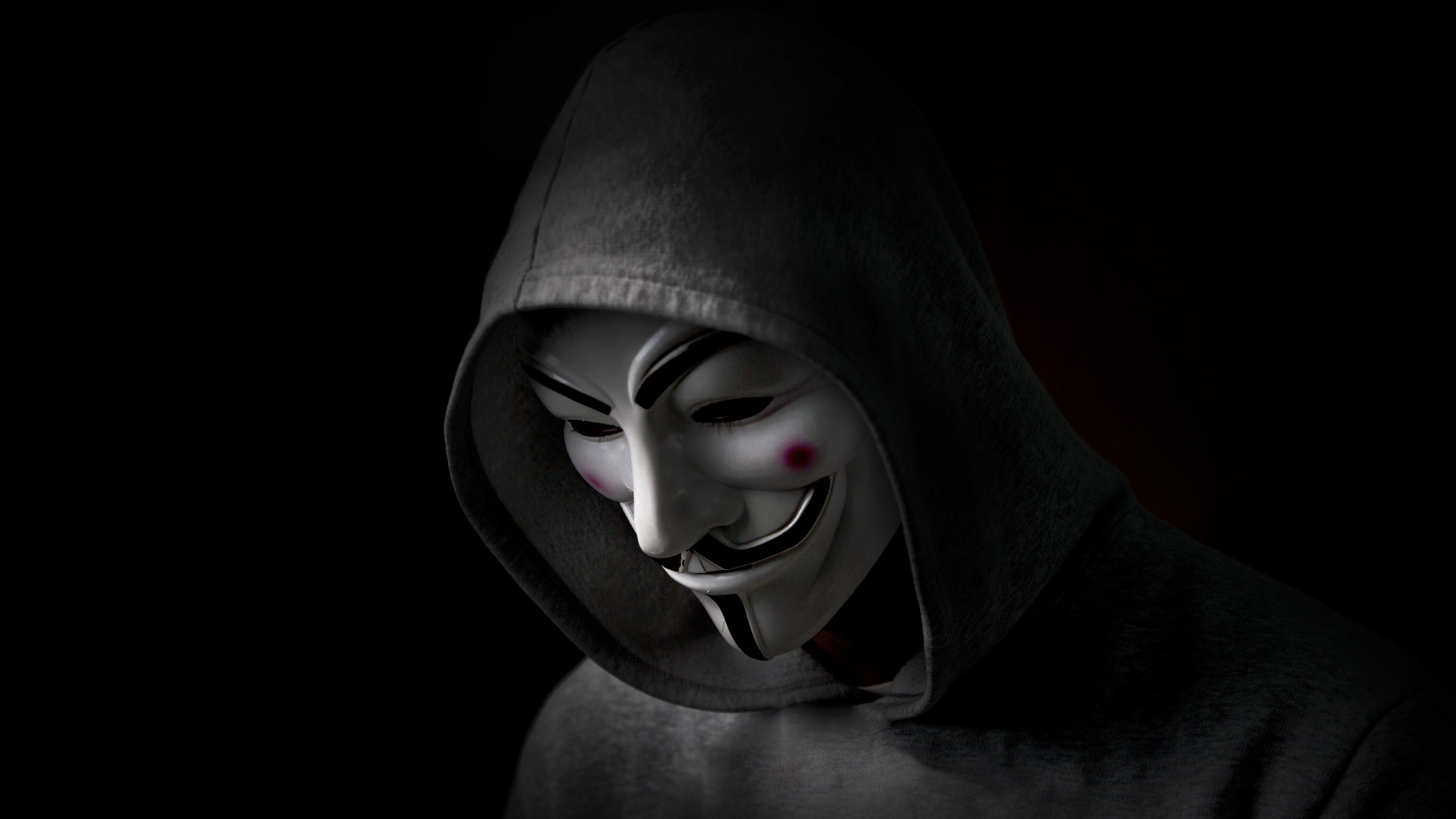 Hooded anonymous in a Guy Fawkes mask 4k Ultra HD Wallpaper