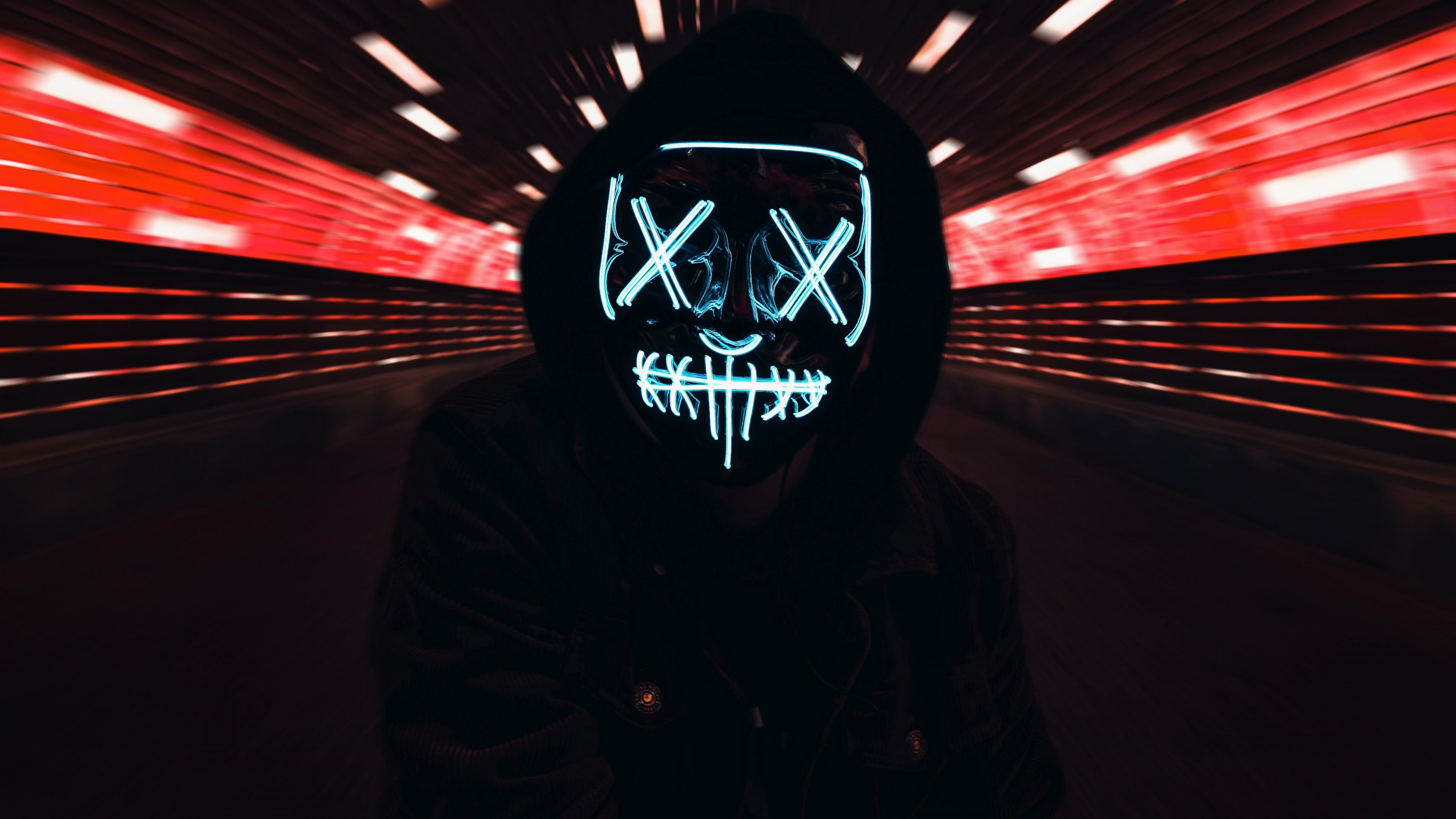 The guy in the black jacket in the neon mask of anonymous on his face wallpaper and image, picture, photo
