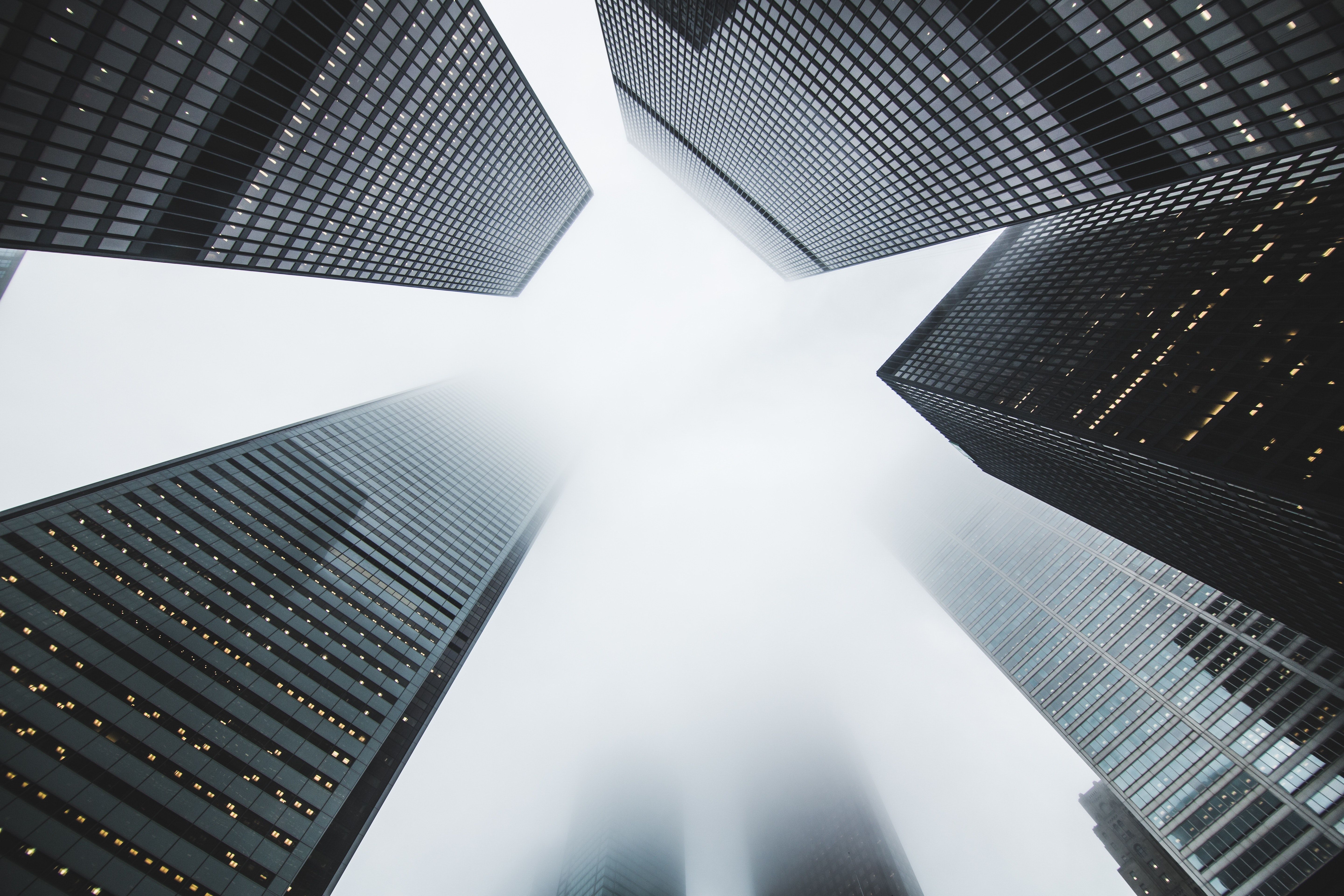 Low Angle Photography Of Buildings Covered By Fog · Free