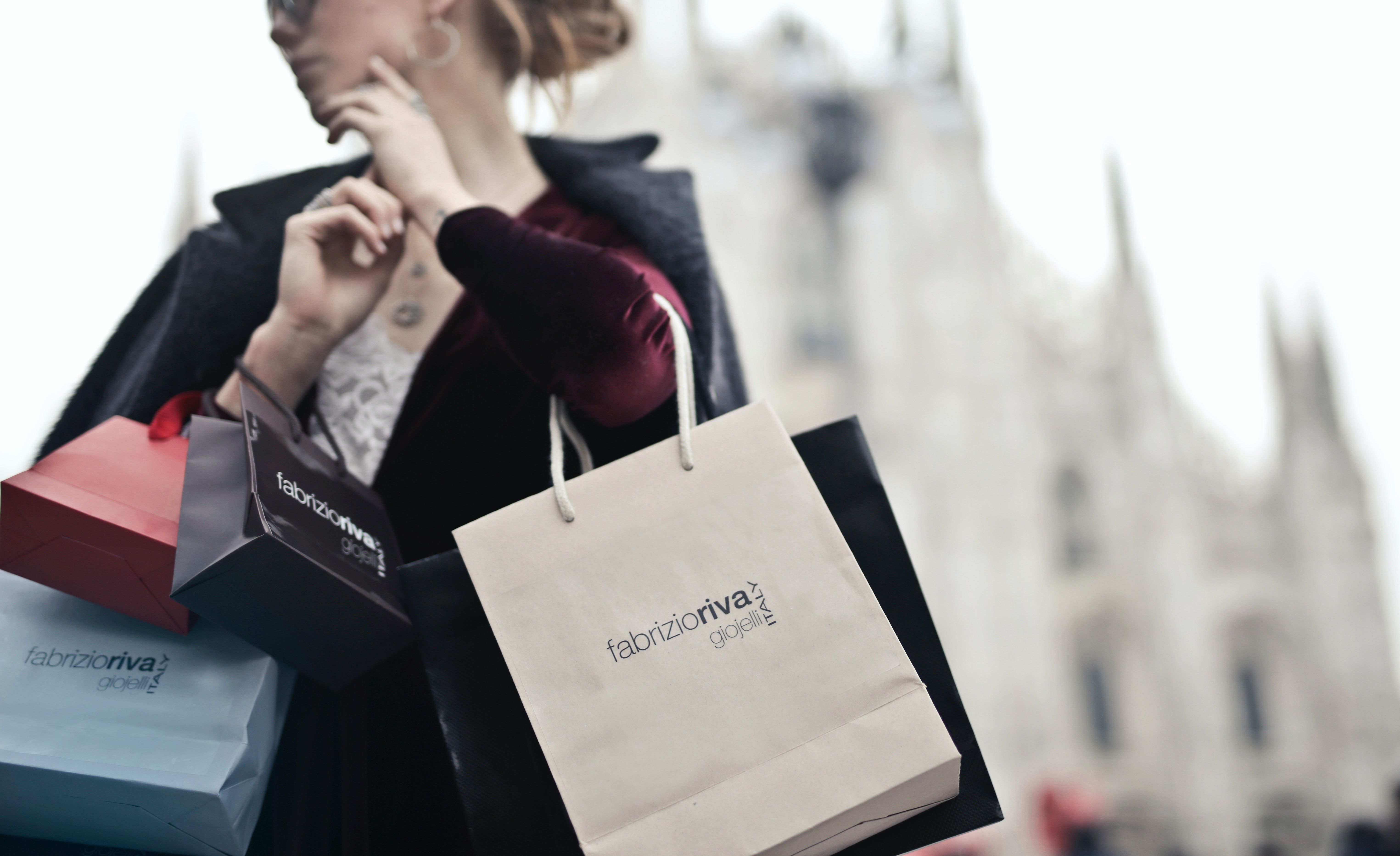 Woman Holding Shopping Bags · Free