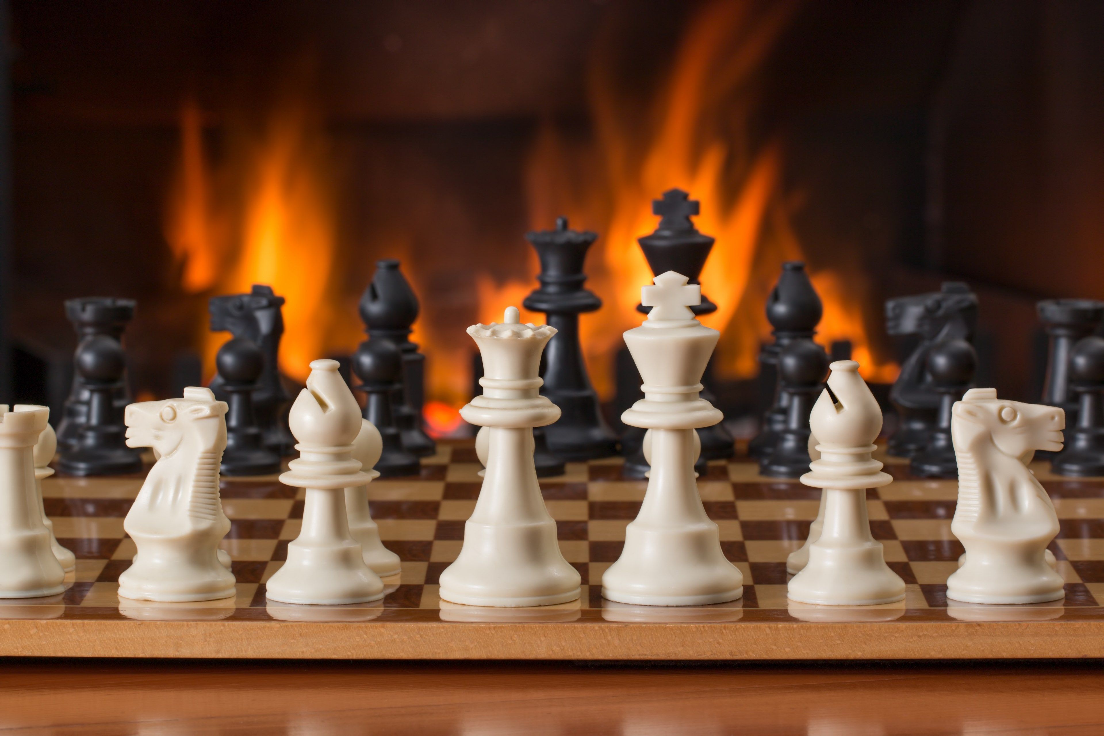 Wallpaper / chess board game fireside strategy play 4k wallpaper