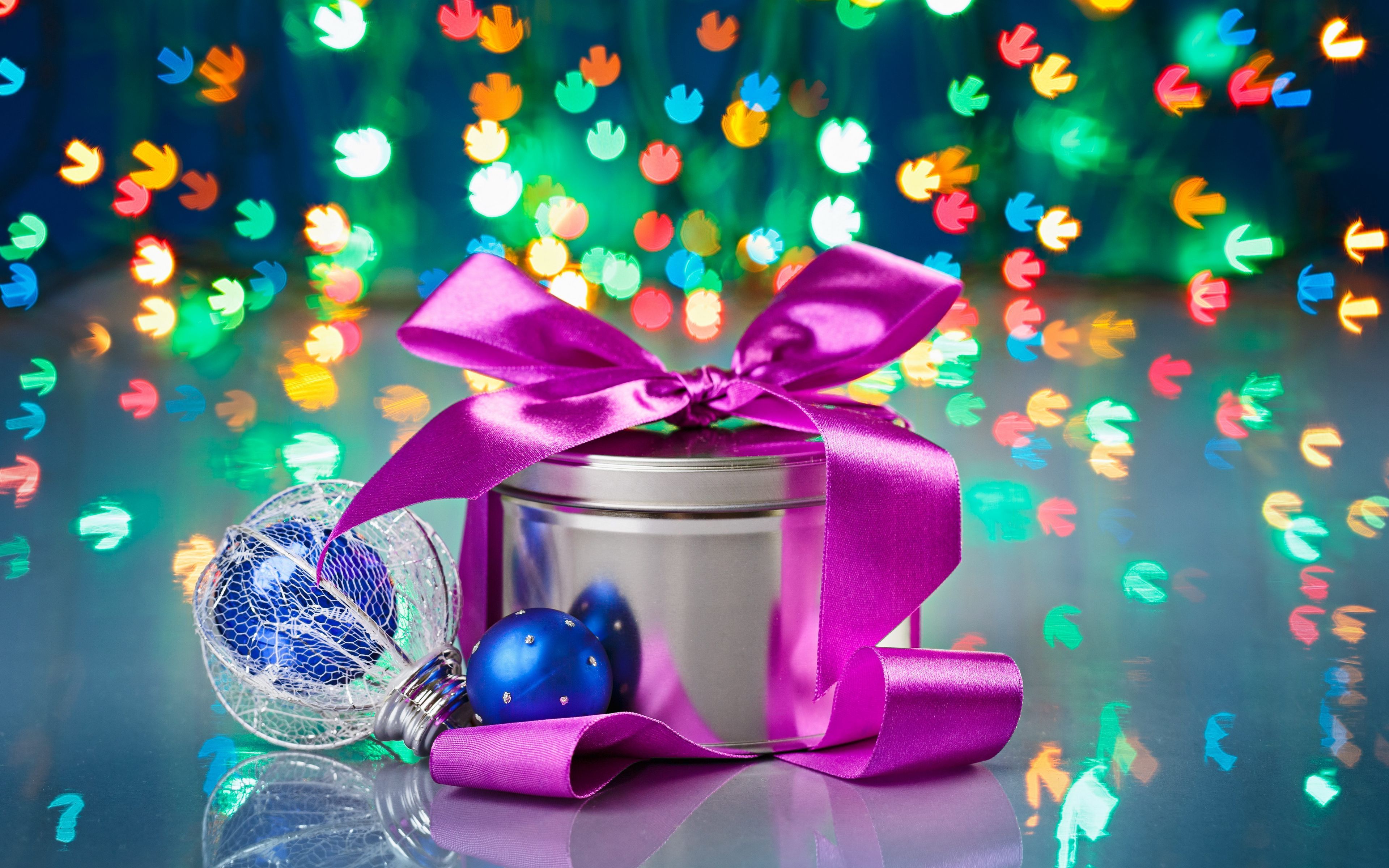 Download wallpaper 3840x2400 metal, bank, gift, new year, reflections, bow 4k ultra HD 16:10 HD background
