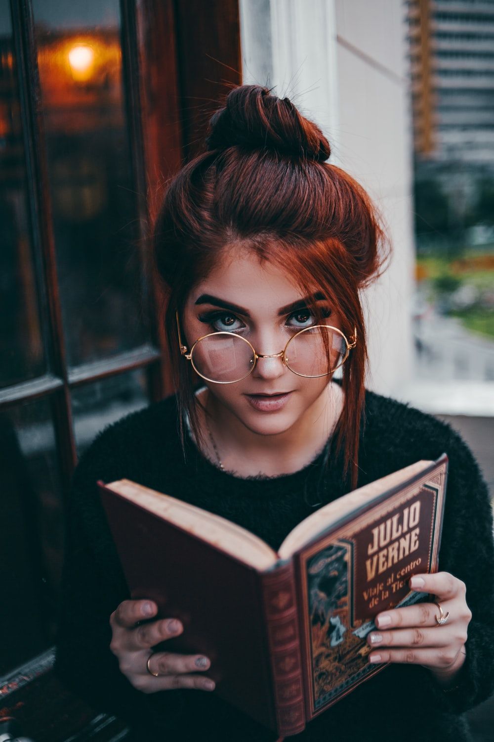 woman standing beside plant photo