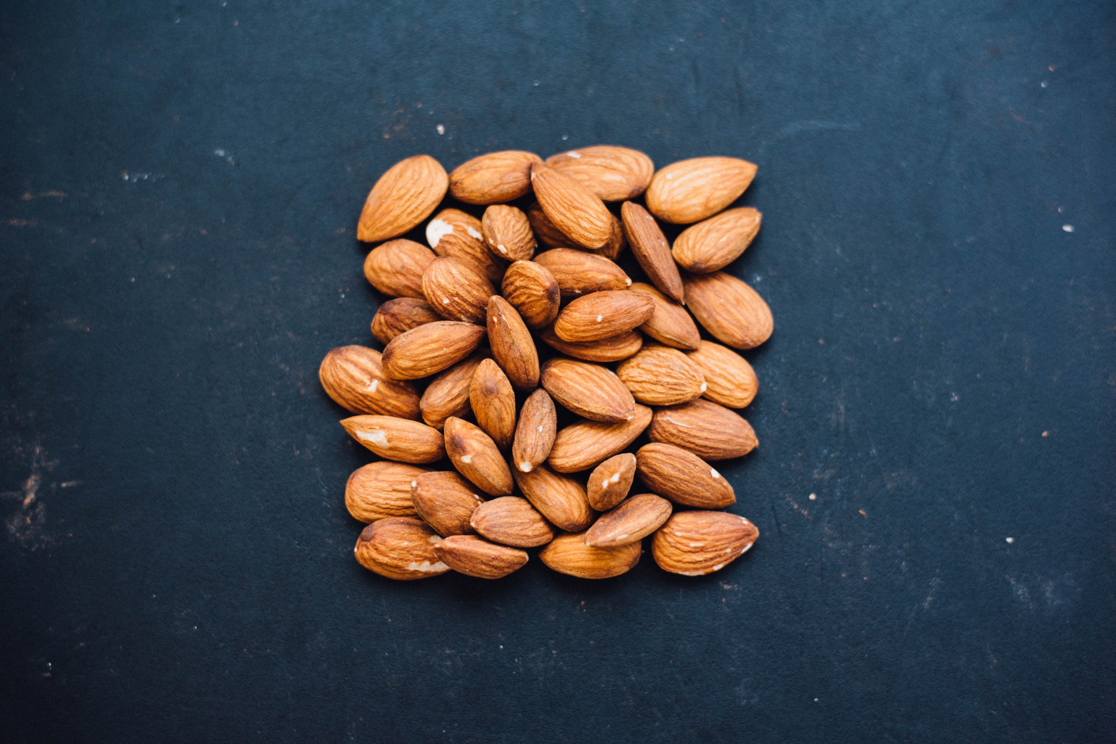 Wallpaper / nuts almonds table and black HD 4k wallpaper
