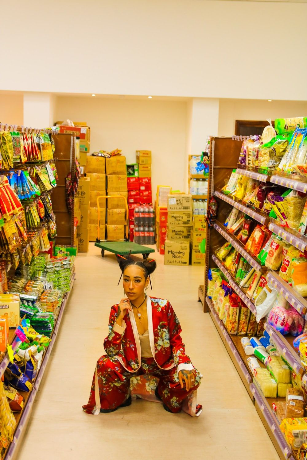 woman squatting on the floor inside the store photo