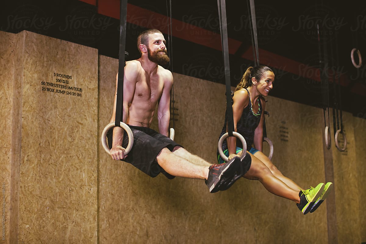 Couple Training With Rings In A Gym Box. by BONNINSTUDIO, Crossfit