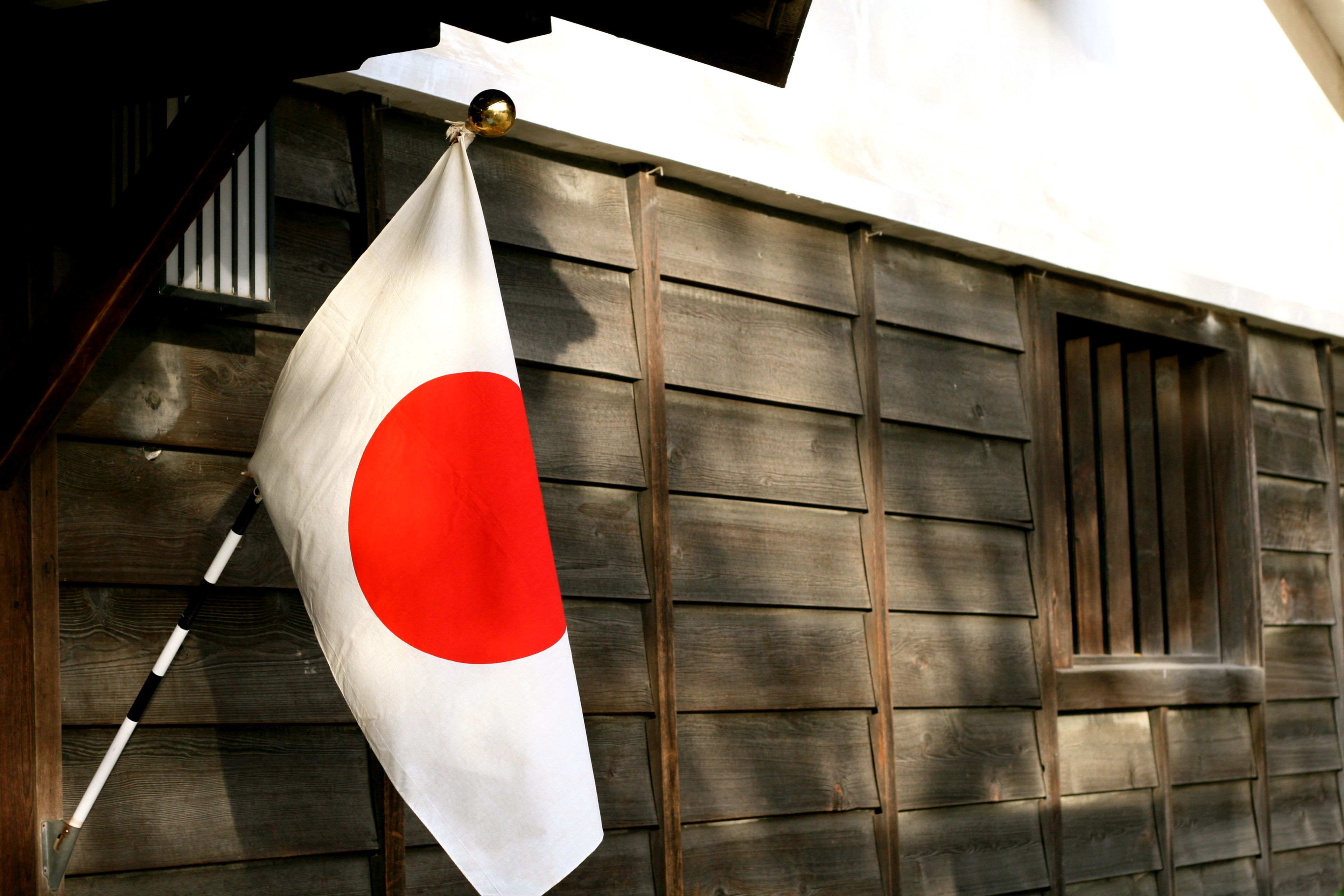 Building Gate Decorated with Japan Flag 4k Wallpaper