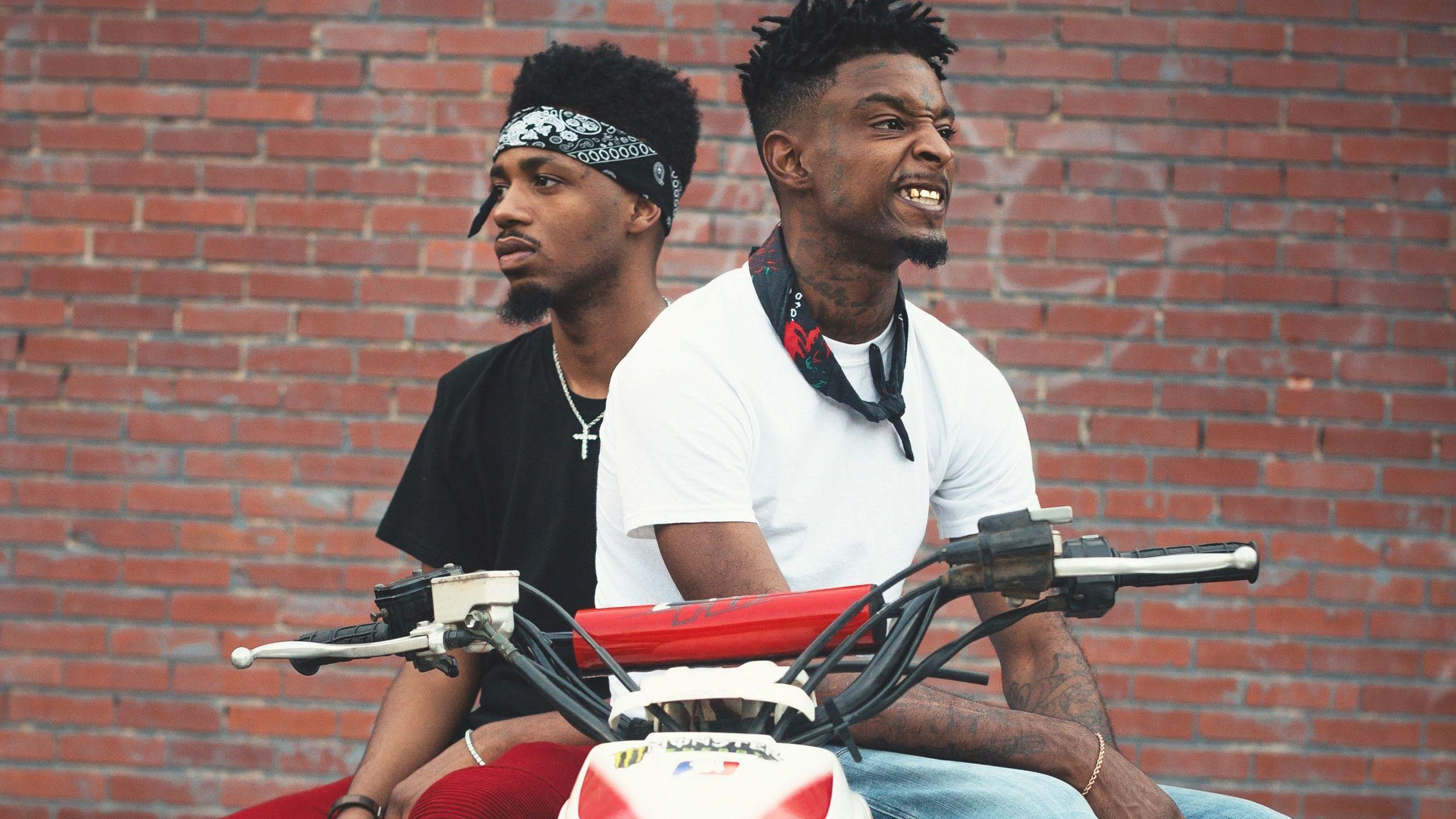 Savage Is Facing One Side Wearing White T Shirt And Blue Jeans Having Kerchief On Neck HD 21 Savage Wallpaper