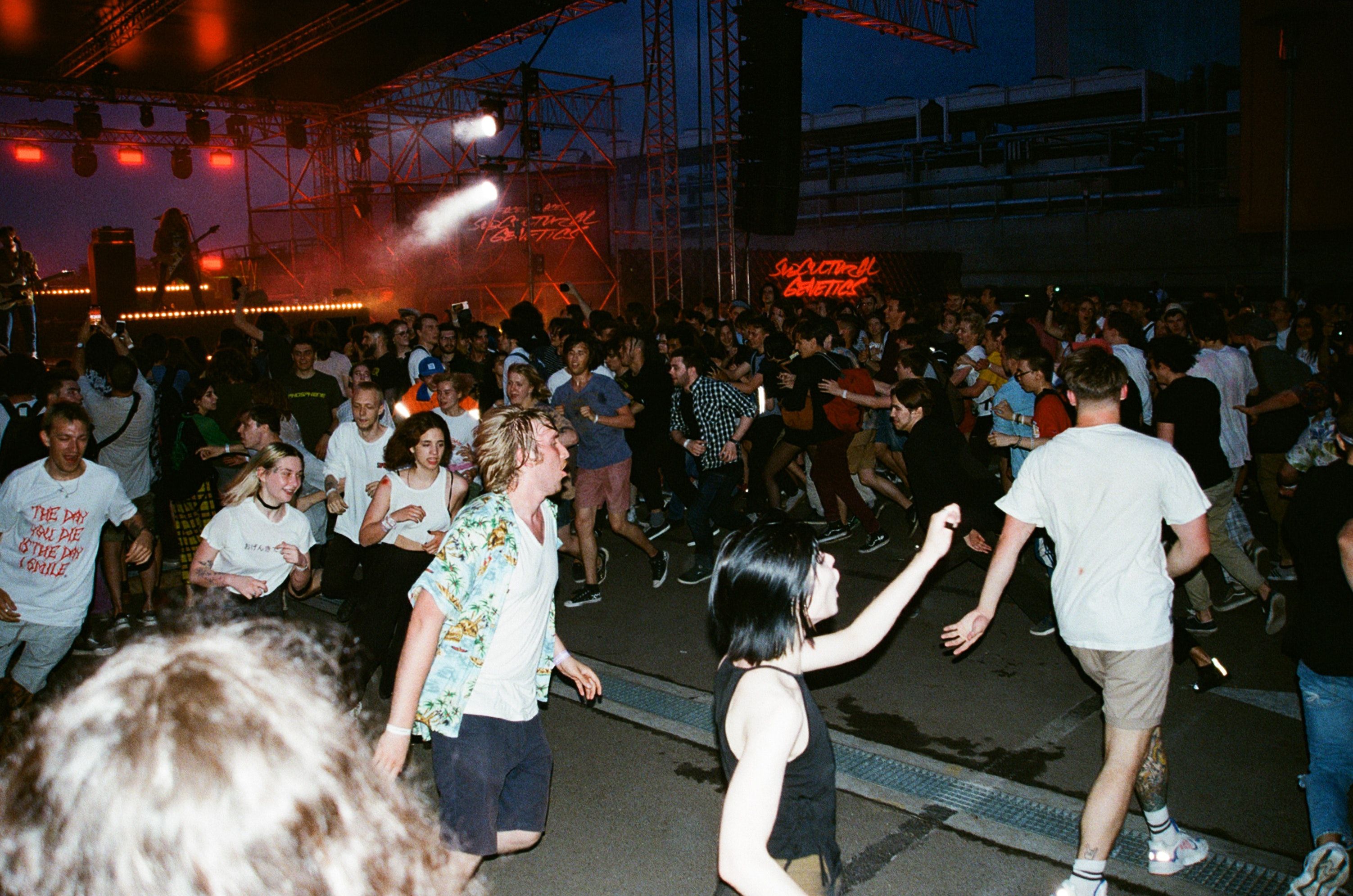 People Starting a Mosh Pit at a Concert · Free