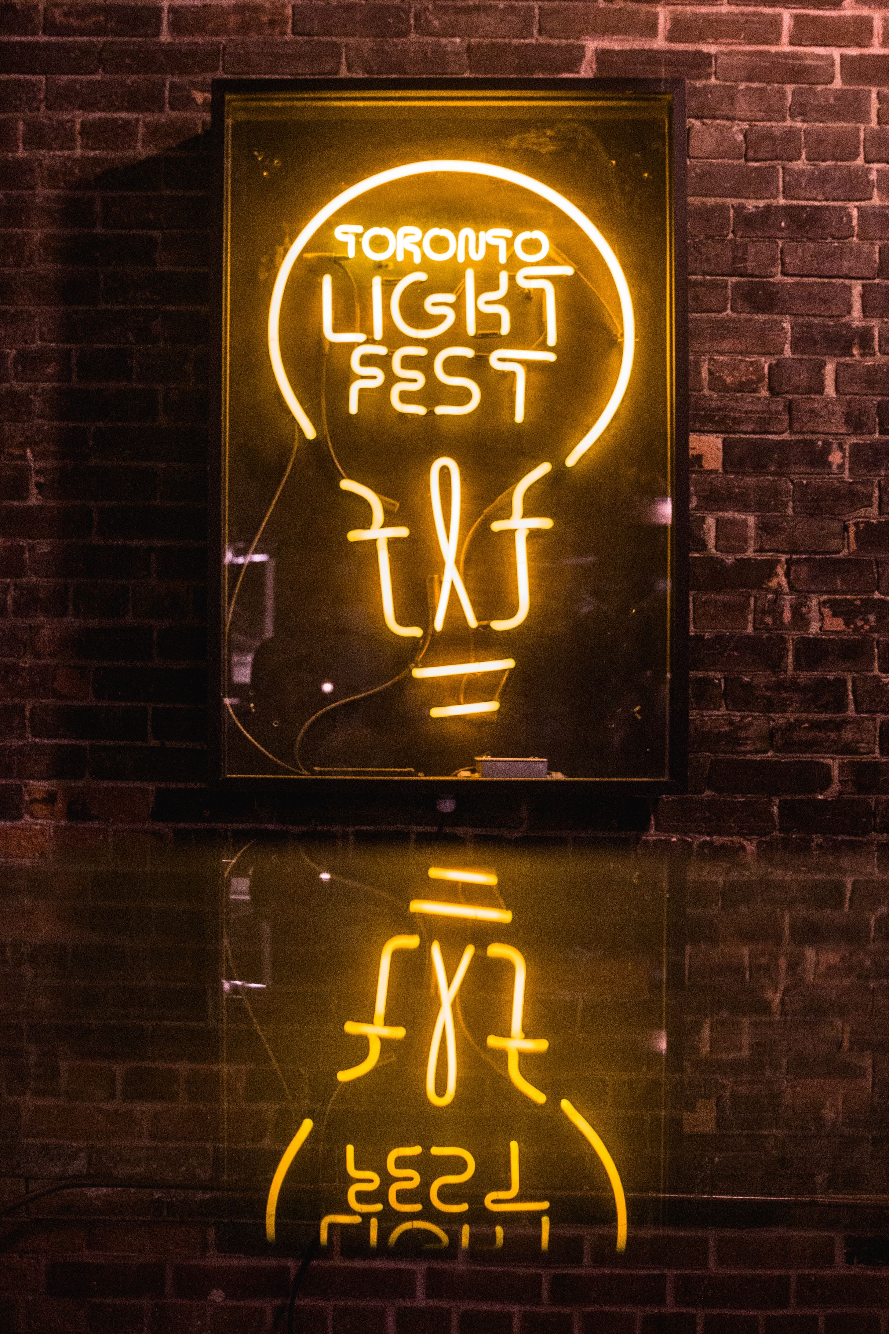 Lighted Neon Sign on the Brick Wall · Free