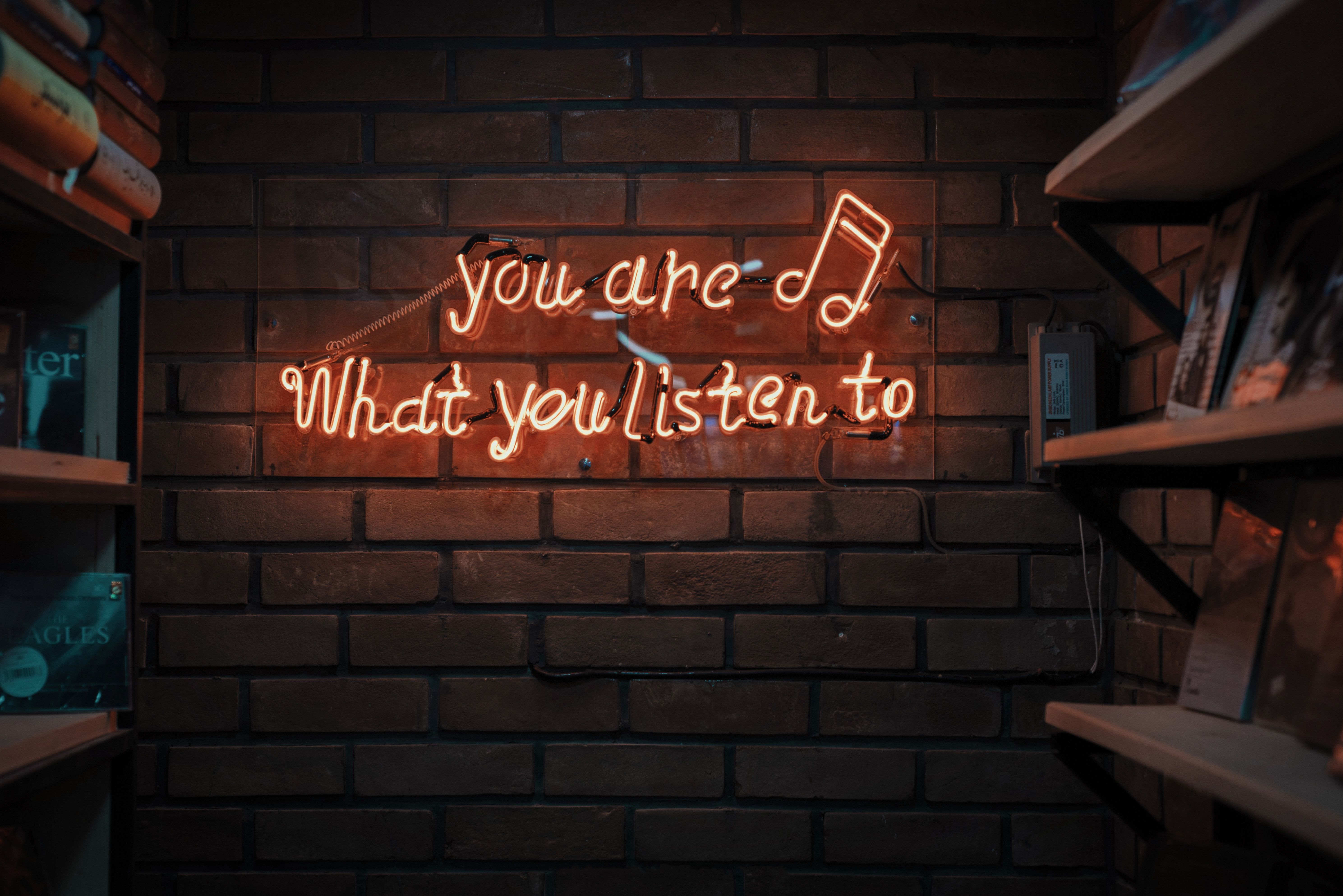 5955x3975 #brick wall, #signage, #neon sign, #sign, #orange, #red, #listen, #time, #crative, #shelves, #, #shop, #music, #note, #store, #life, #neon orange, #neon, #Creative Commons image, #audio, #wall. Mocah HD Wallpaper