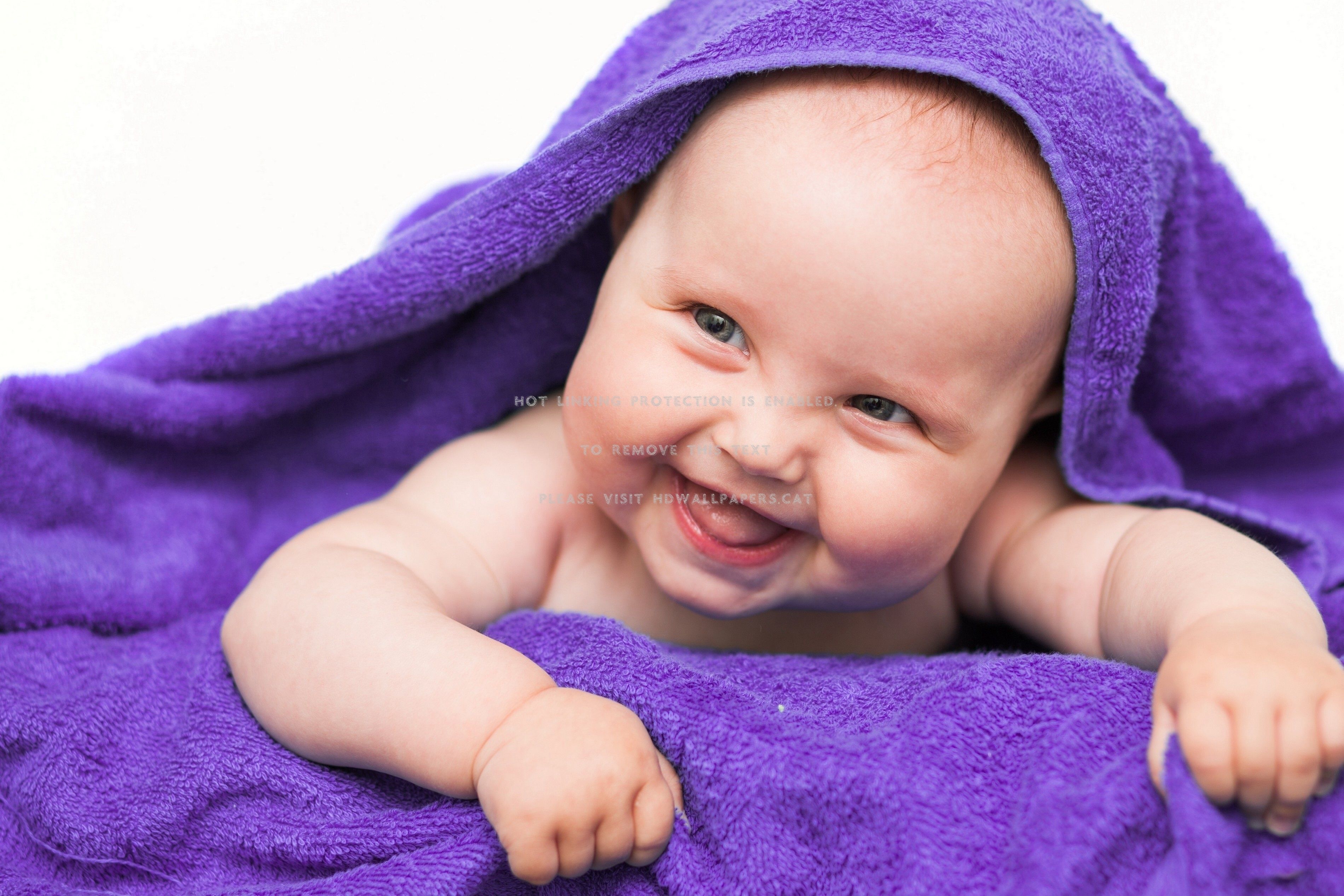laughing child purple towel people
