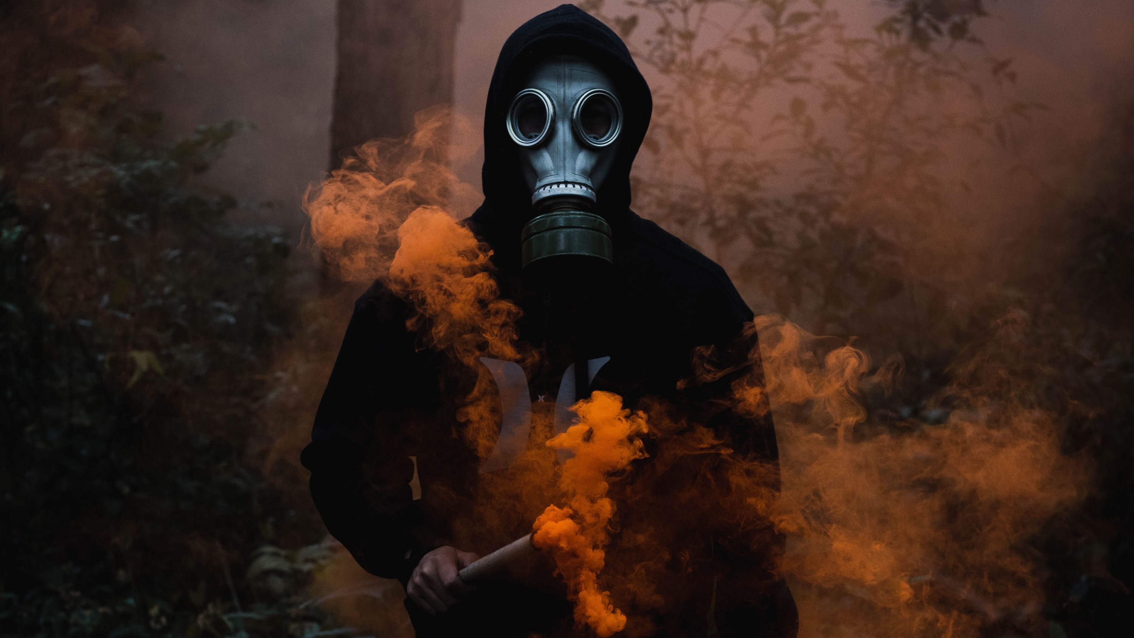 Man in Mask 4K Wallpaper, Black Jacket, Smoke can, Dark Background, Orange Smoke, 5K, Photography