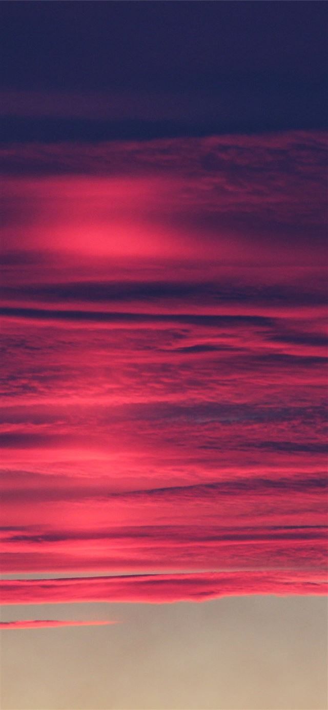 red pink burning clouds 4k iPhone 12 Wallpaper Free Download