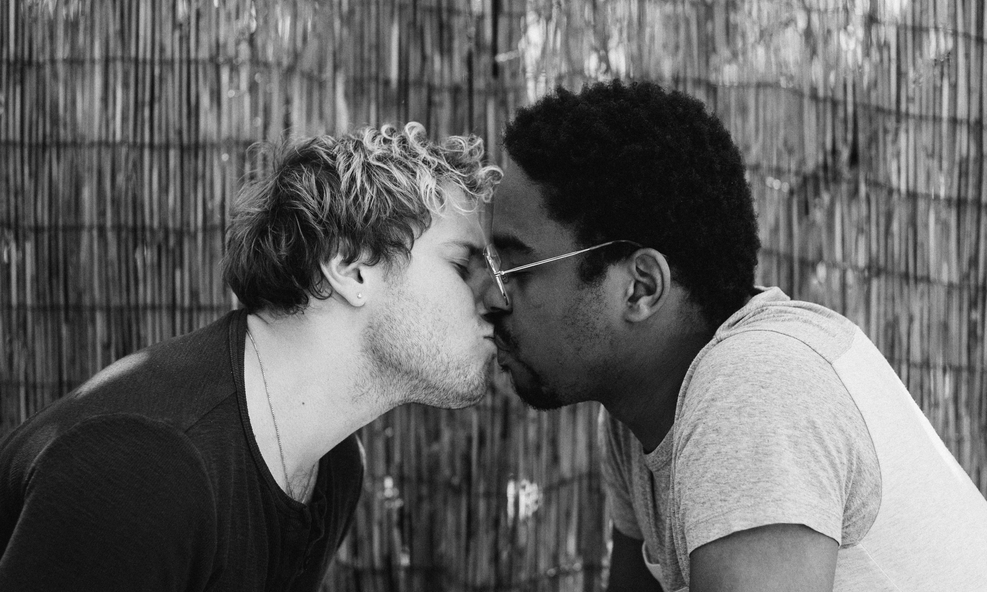 Black and White Photo of Two Men Kissing · Free