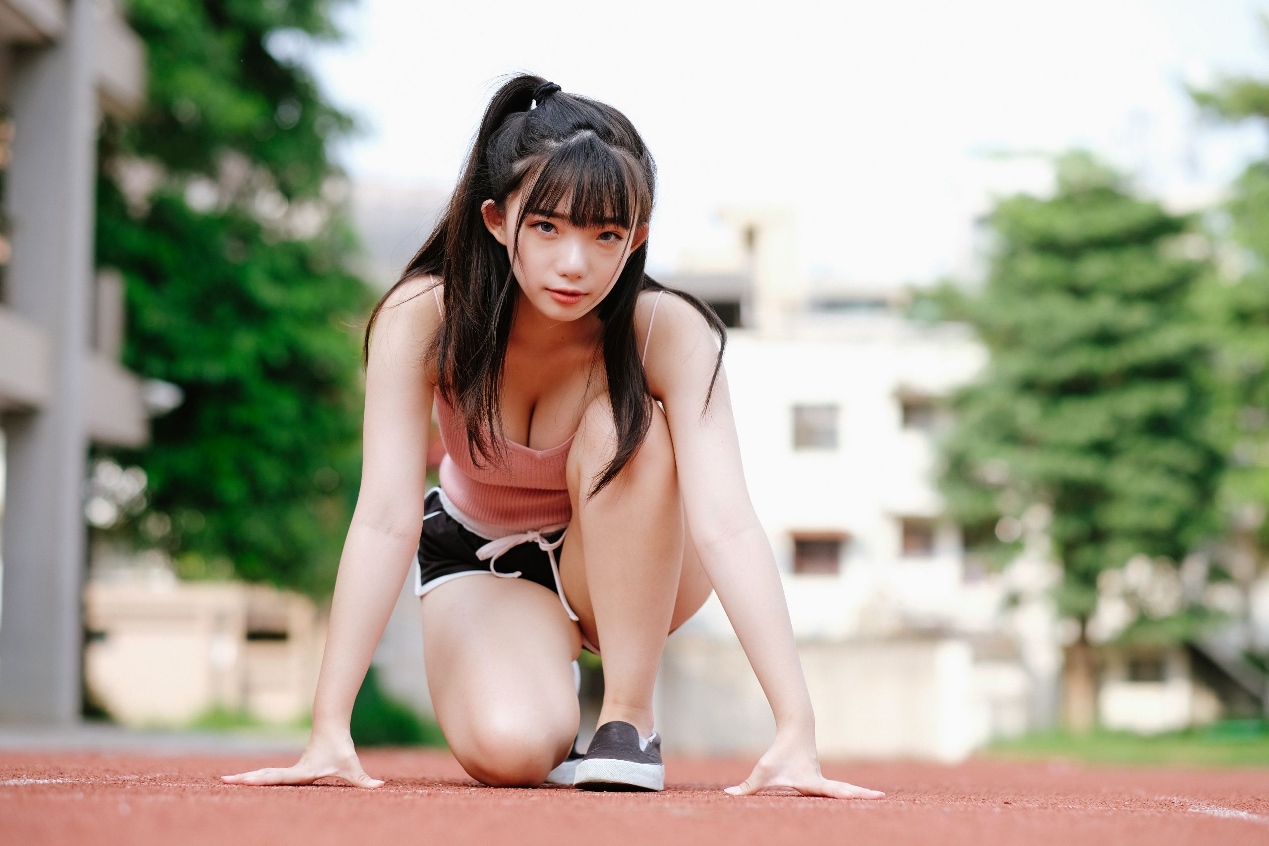 Wallpaper, Asian, model, brunette, long hair, bangs, looking at viewer, pink tops, cleavage, short shorts, depth of field, kneeling, portrait, women outdoors 2560x1707