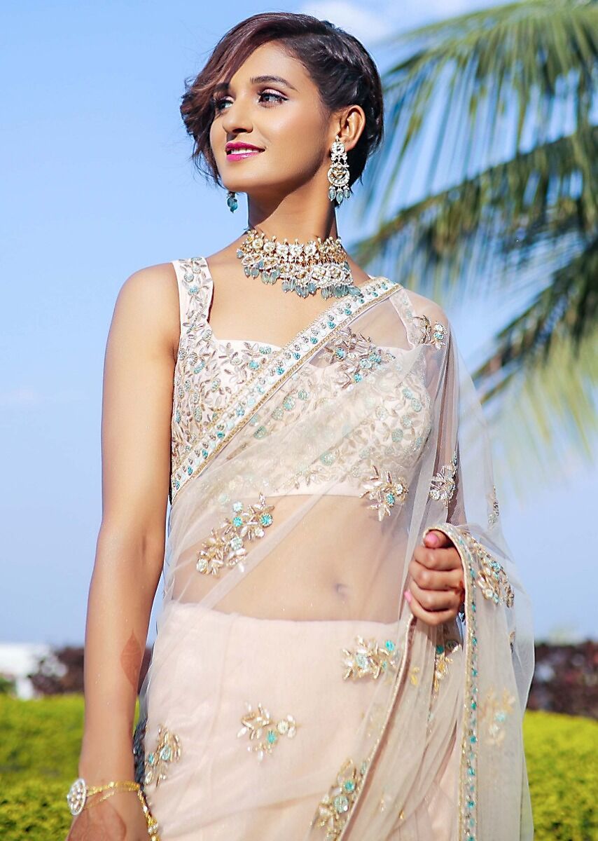 Shakti Mohan in Kalki powder pink net saree with floral embroidered butti.