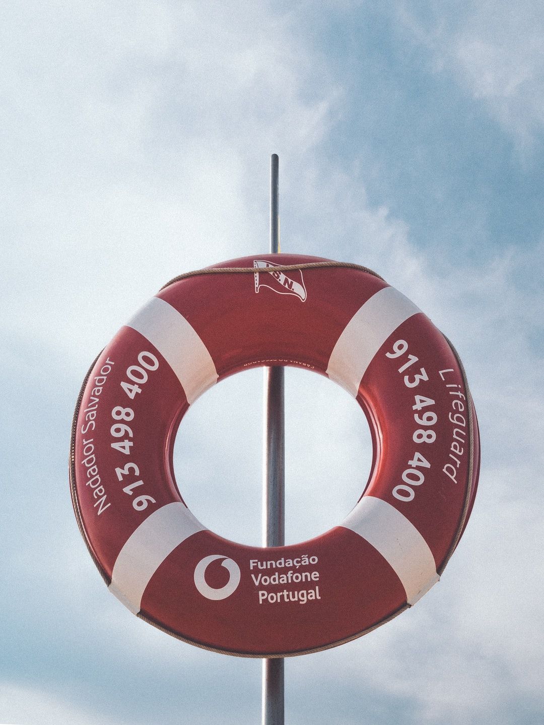 photo of red and white Vodafone inflatable floater photo