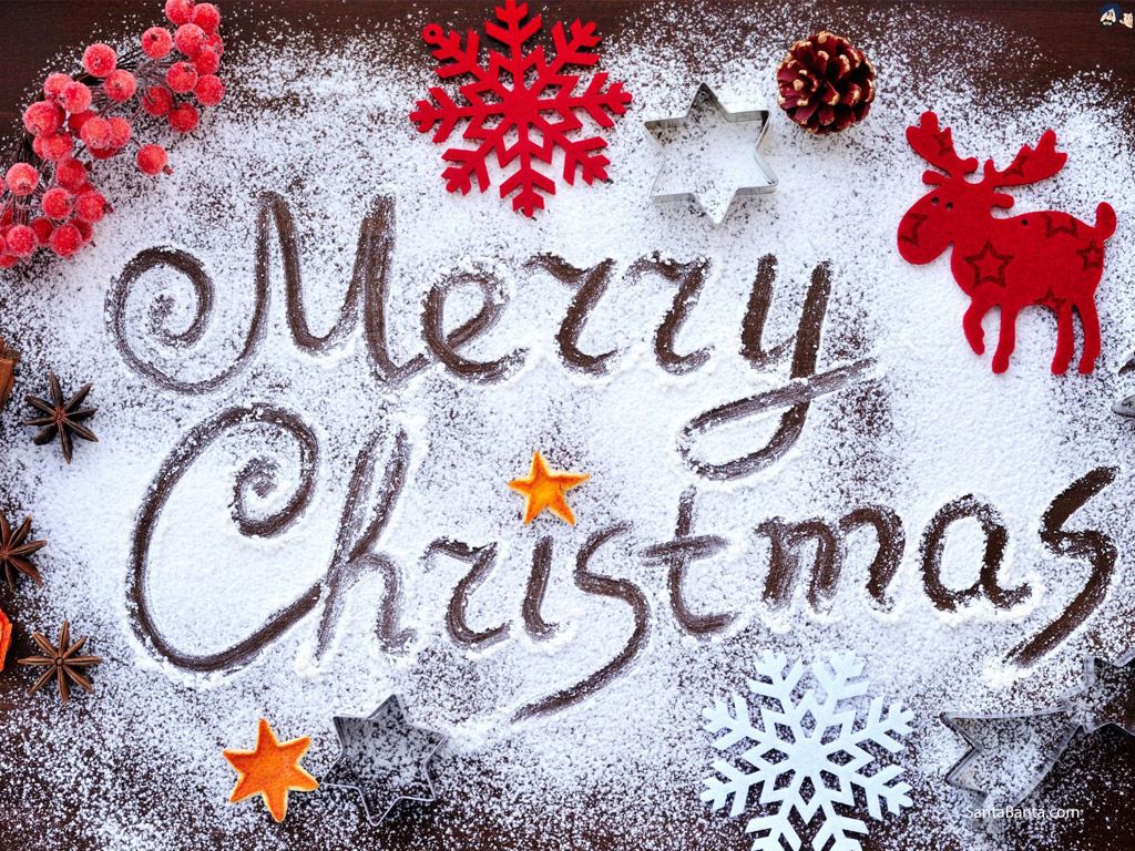 Merry Christmas and Xmas decorations icing on a cake