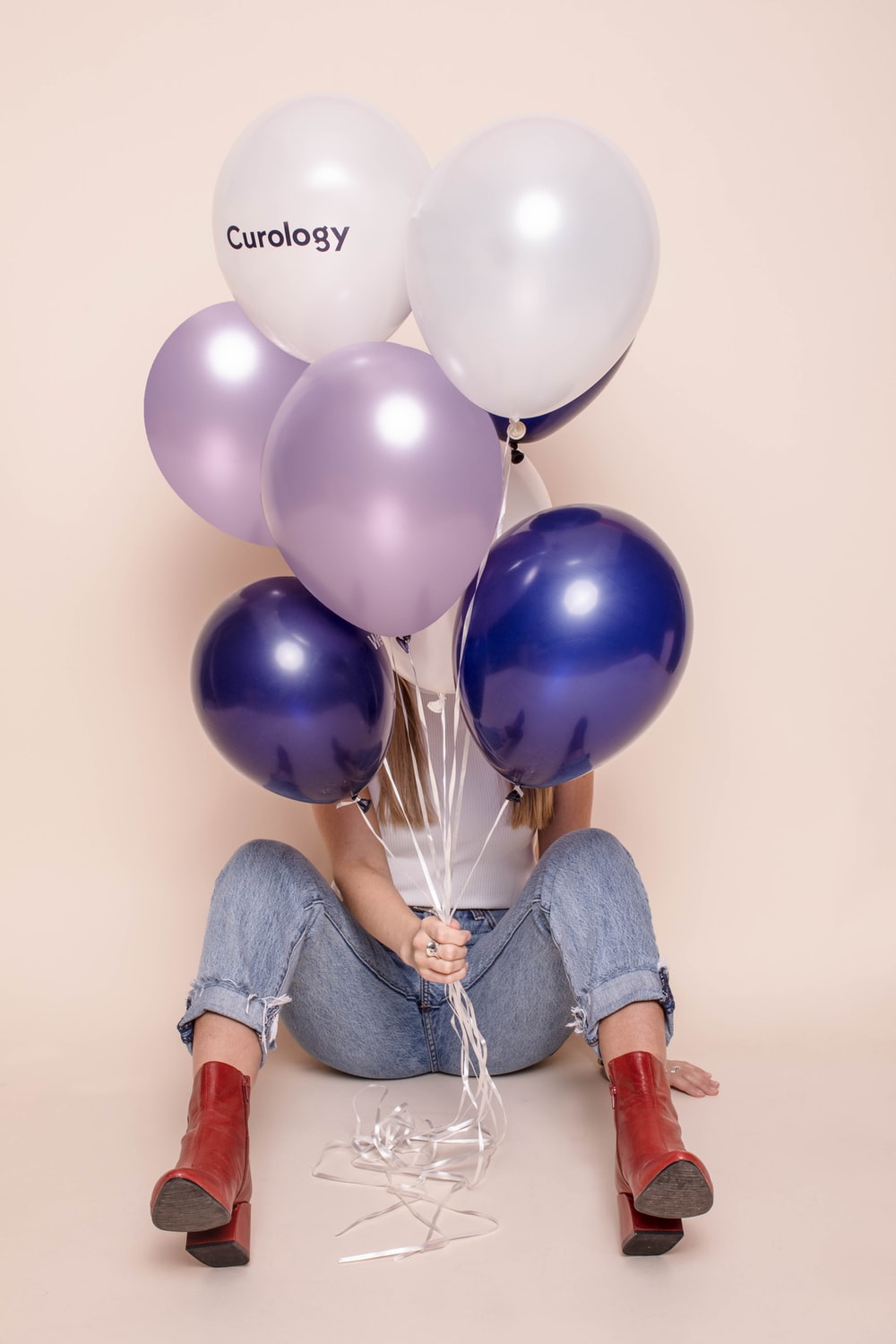 Woman Holding Six Assorted Color Balloons Photo