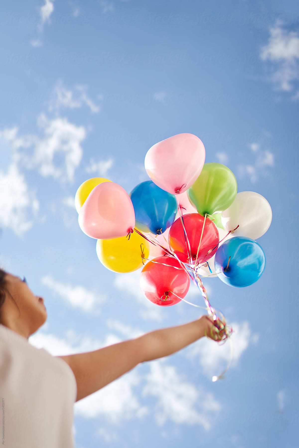 Young Woman Holding Balloons