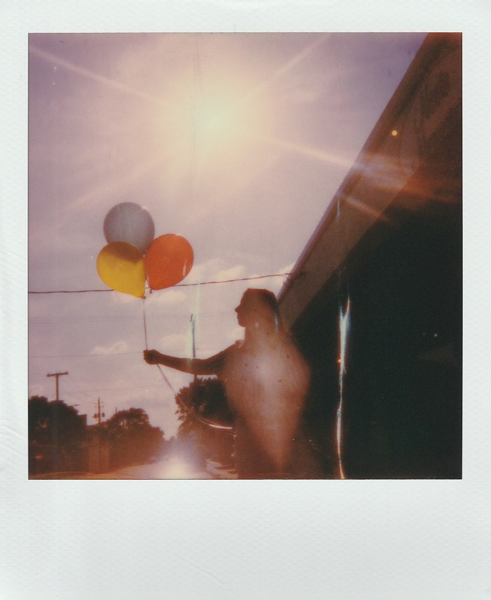 Photo Of A Women Holding Three Balloon Close Up Photography Photo