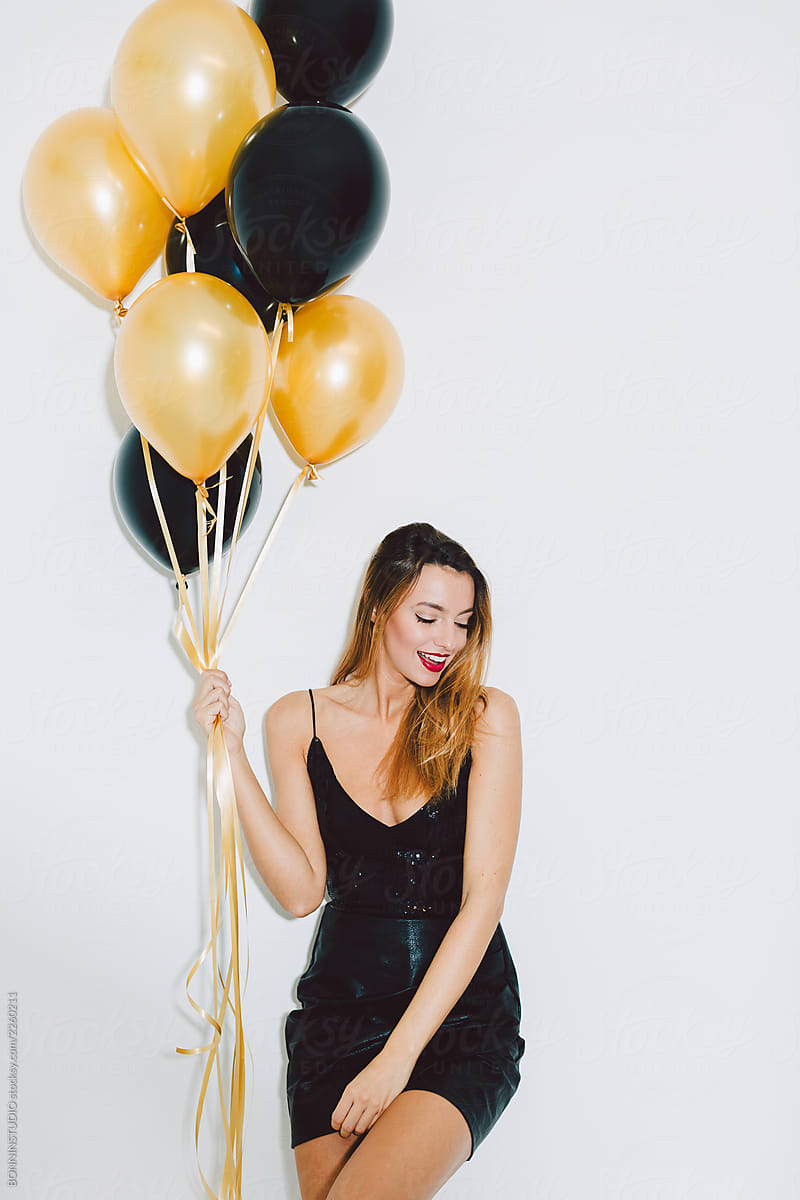 Woman Holding Balloons In A New Year Party Celebration