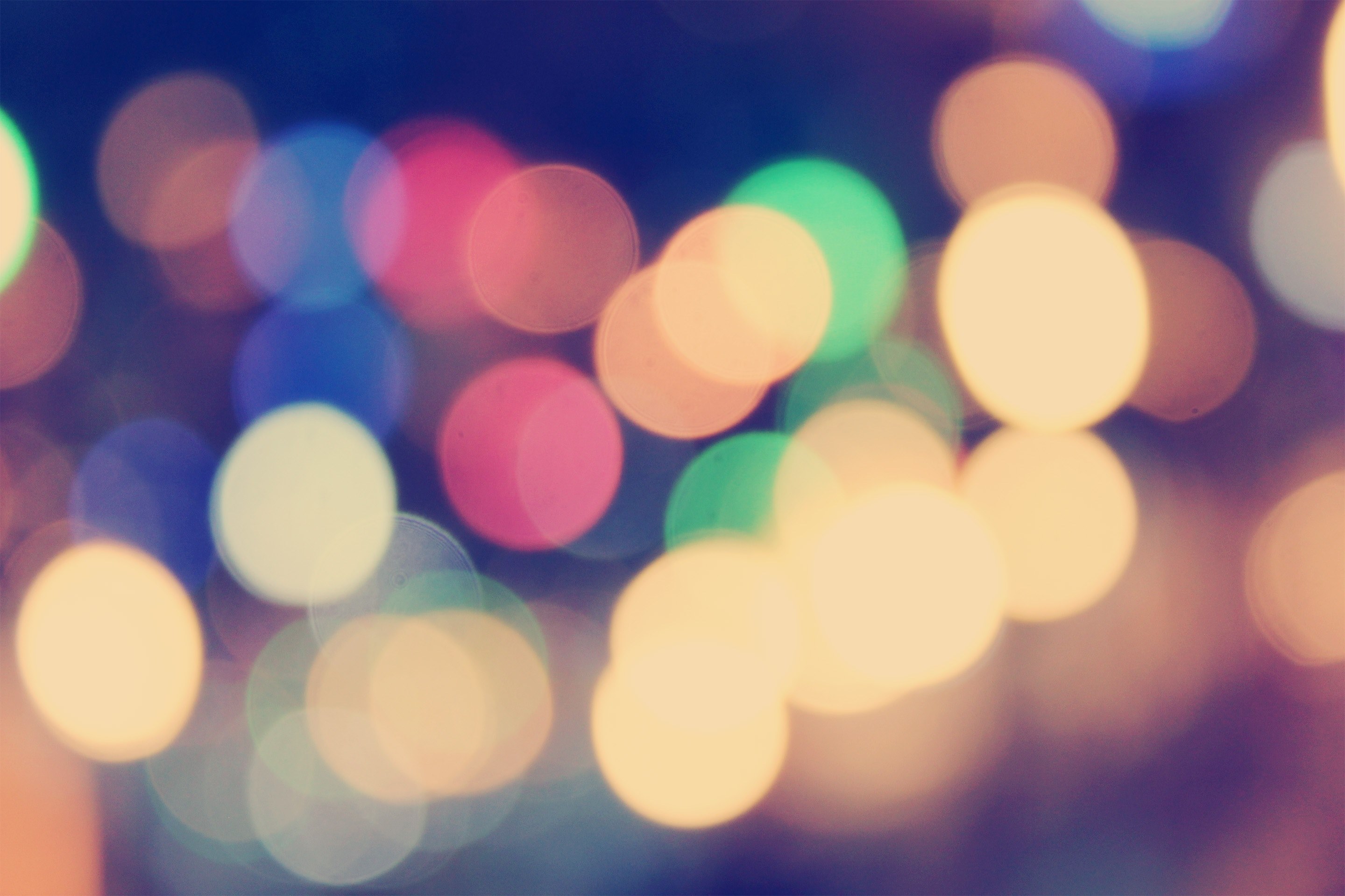 Wallpaper / a colorful bokeh effect against a black background, colorful bokeh 4k wallpaper