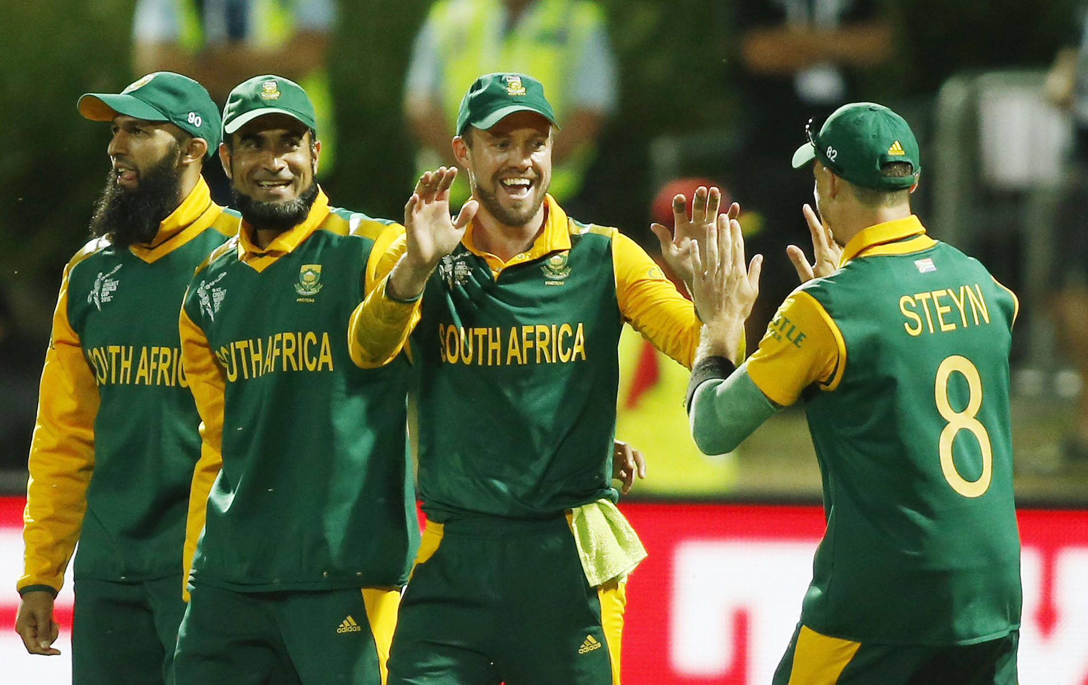 South Africa's De Villiers celebrates with team mate Steyn after dismissing Zimbabwe's Mire out caught during their Cricket World Cup match in Hamilton