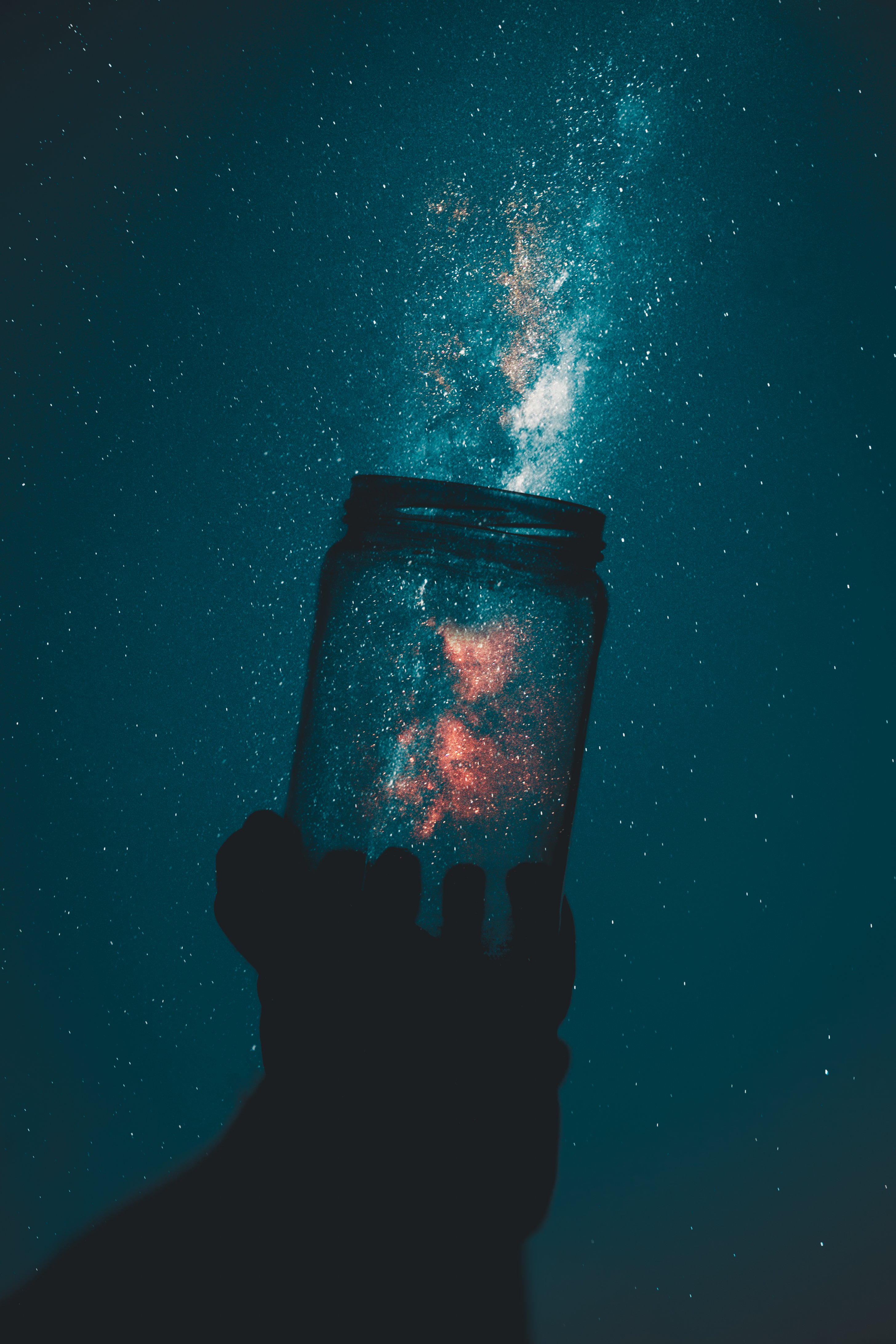 Creative Photo of Person Holding Glass Mason Jar Under A Starry Sky · Free