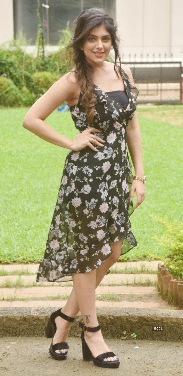 Ishita Chauhan looks pretty in a black floral dress as she strikes a pose during the promotion of Bollywood film 'Genius' in Mumbai