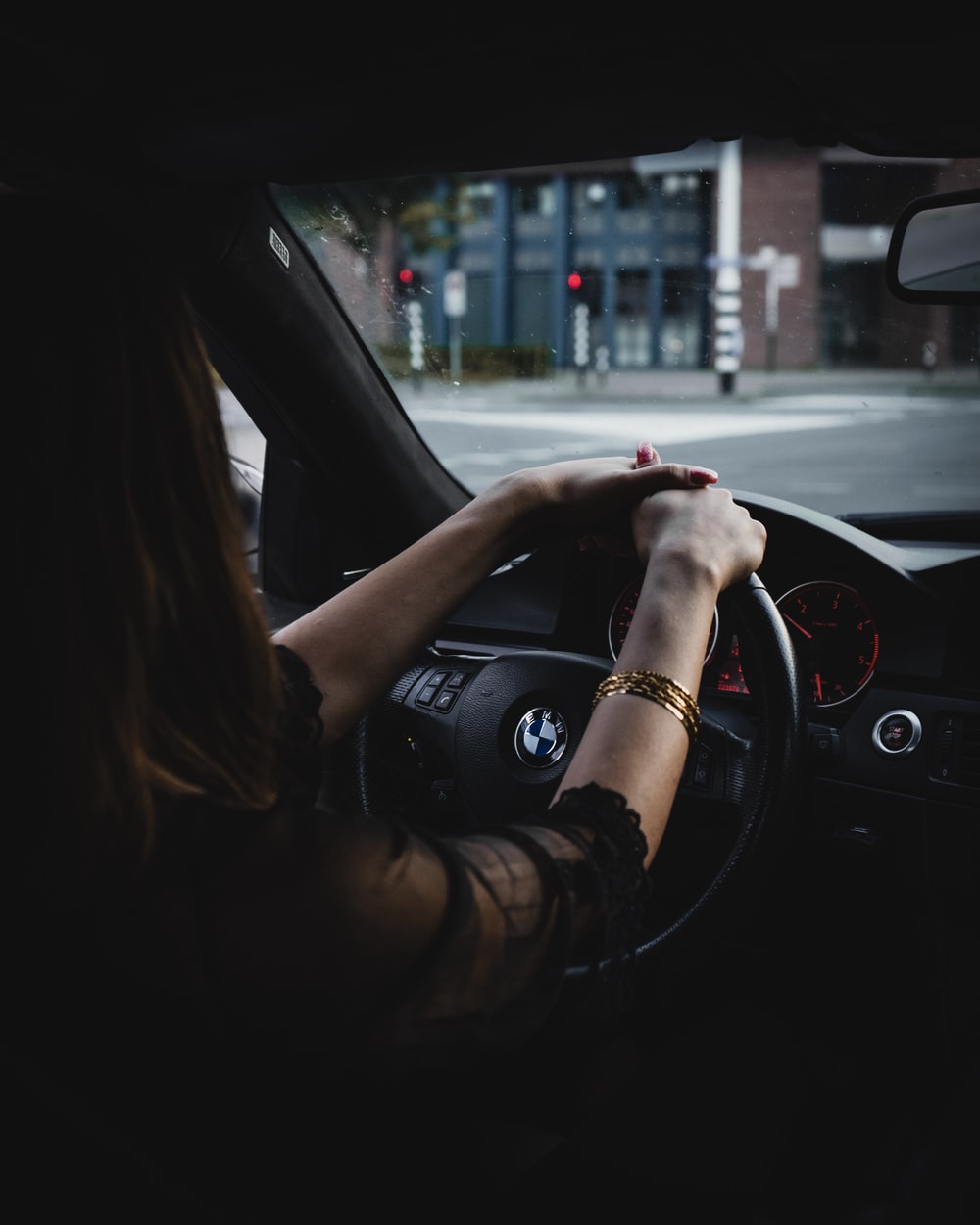 woman inside BMW car holding steering wheel photo