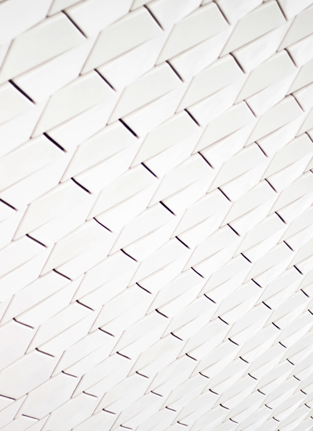 A pattern of white geometric shapes in a facade photo