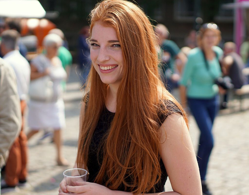 German girl with cup. Red hair woman, Redhead day, German girl