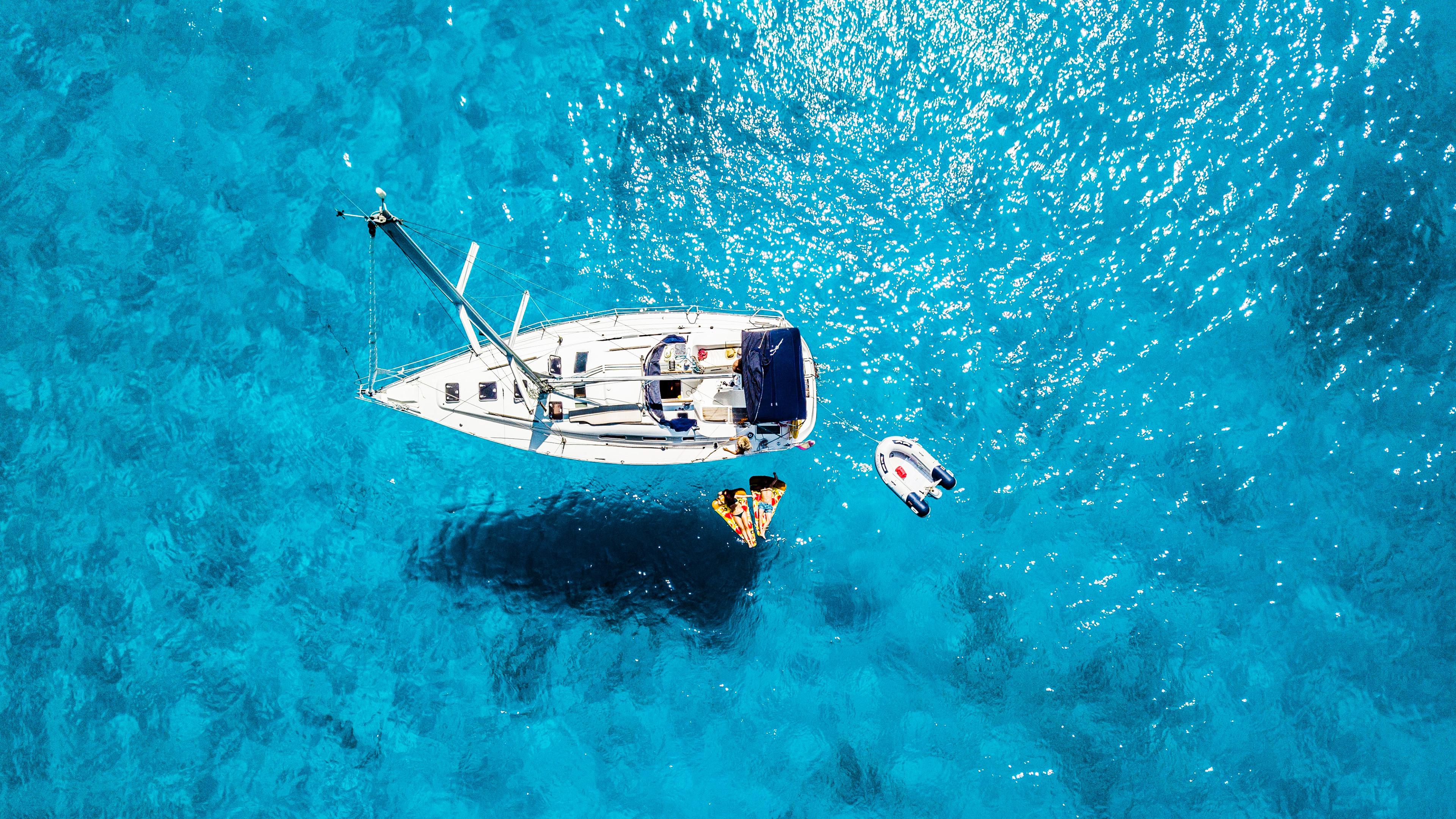 Boat on Blue Sea 4K Wallpaper
